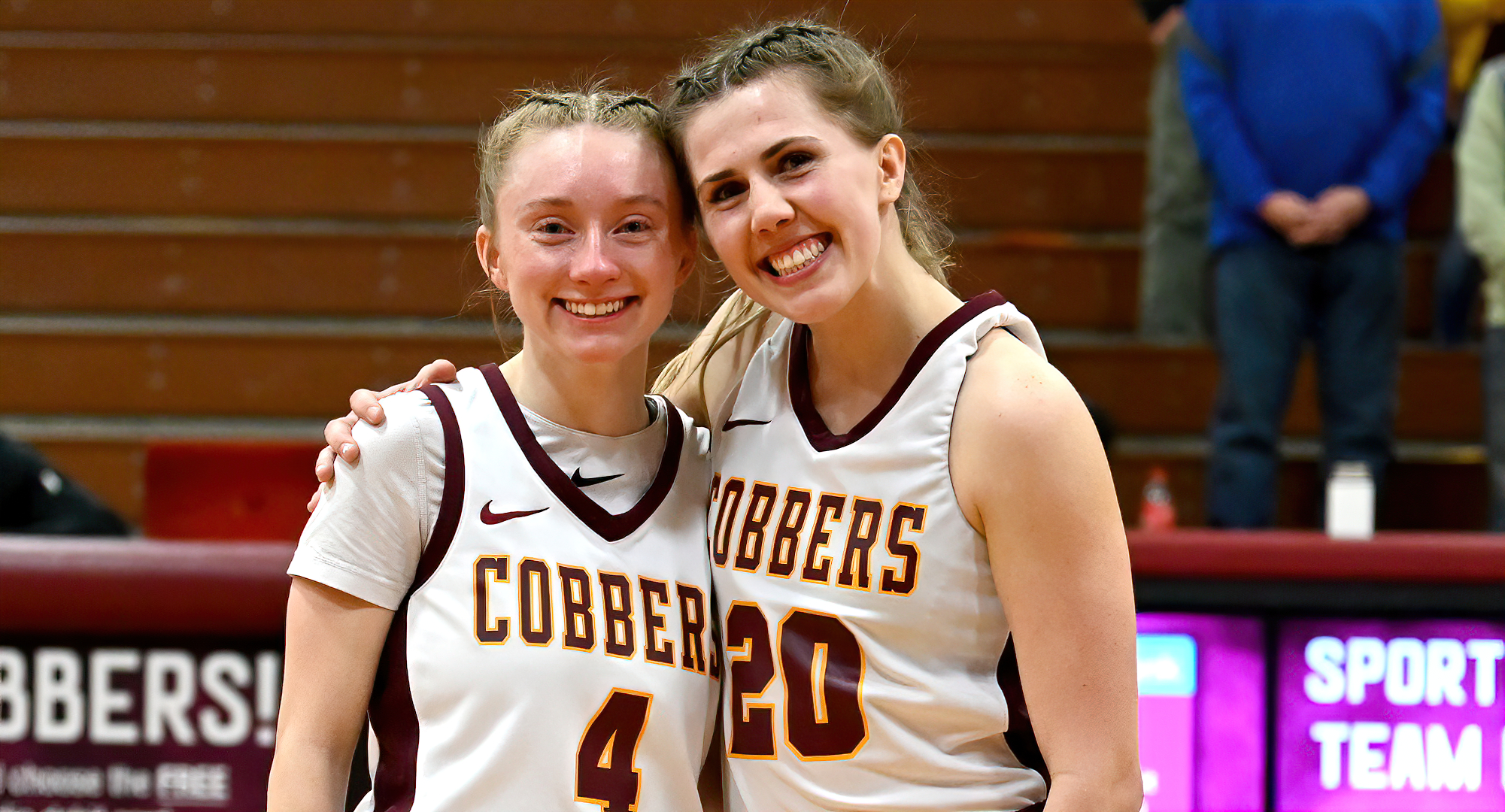 Cobber seniors Maddie Guler (L) and Emily Beseman were honored at halftime of the annual Senior Celebration Game.