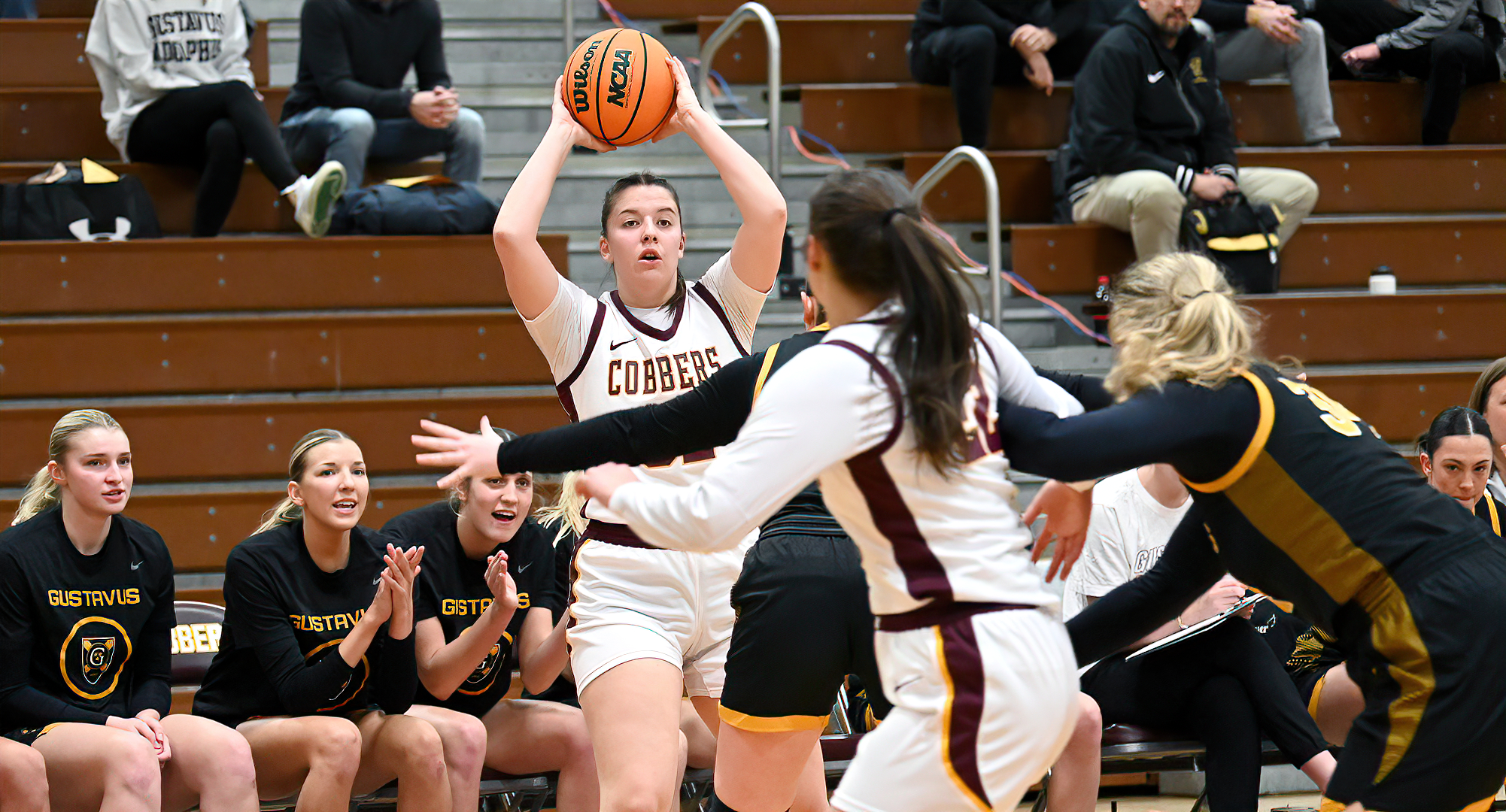 Senior Greta Tollefson looks to make an entry pass to Makayla Anderson in the Cobbers' game with Gustavus.