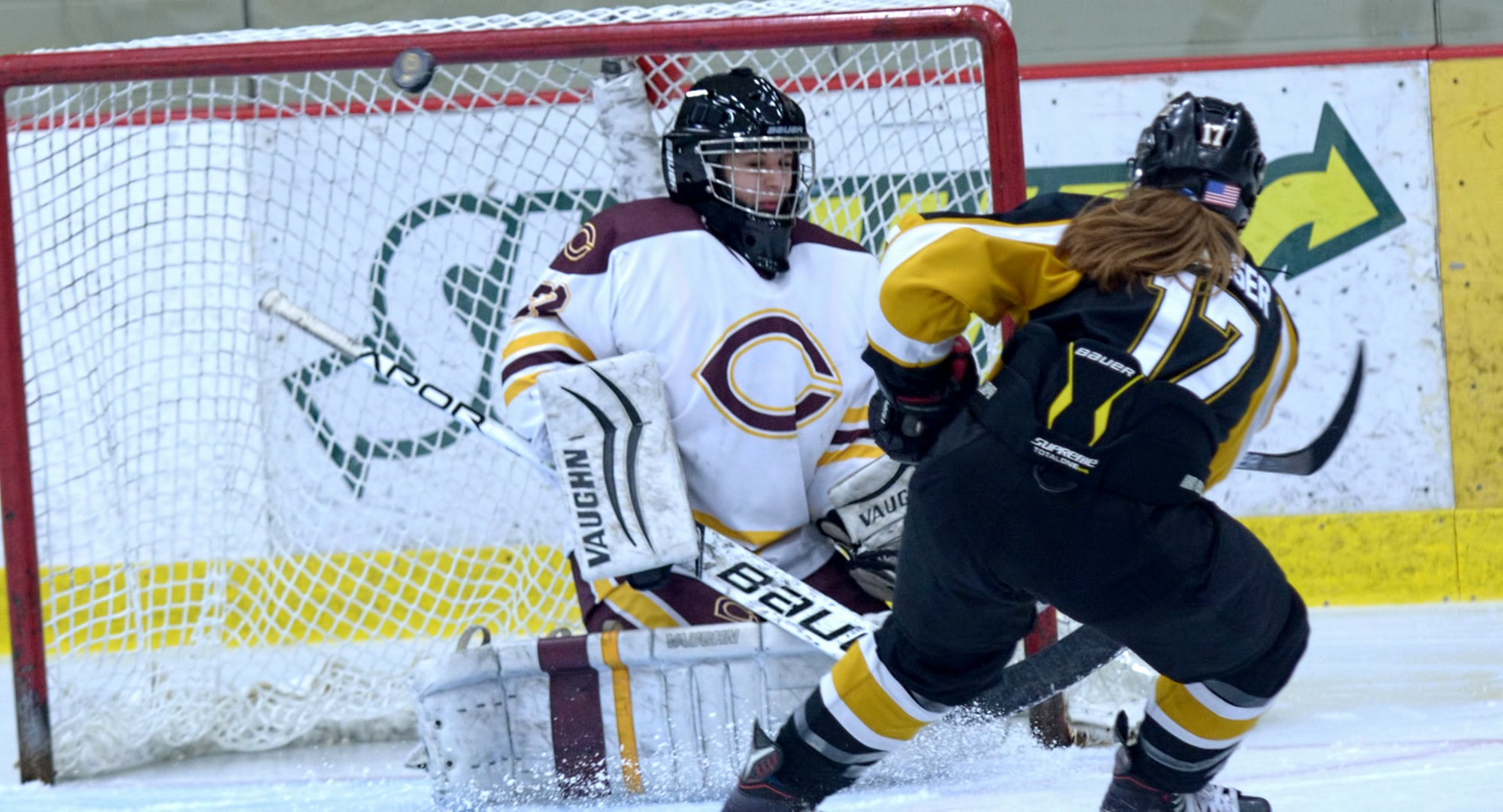 Cobber goalie Brittany Boss watches the puck deflect away from goal after making a save during the second period of the Cobbers' series finale with St. Olaf.