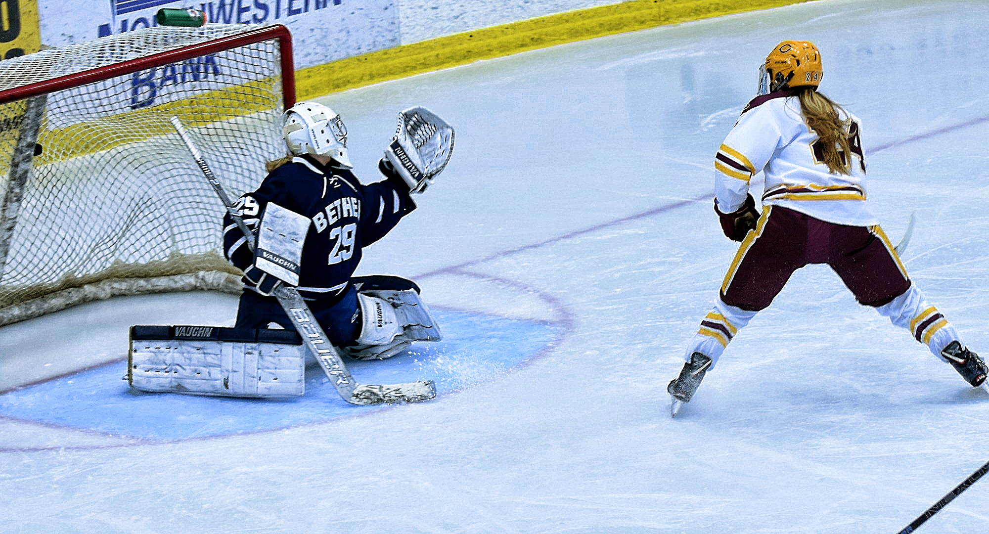 Sophomore Kaitlyn Page buries the puck in the Bethel net on a breakaway in the third period of the Cobbers' home opener.