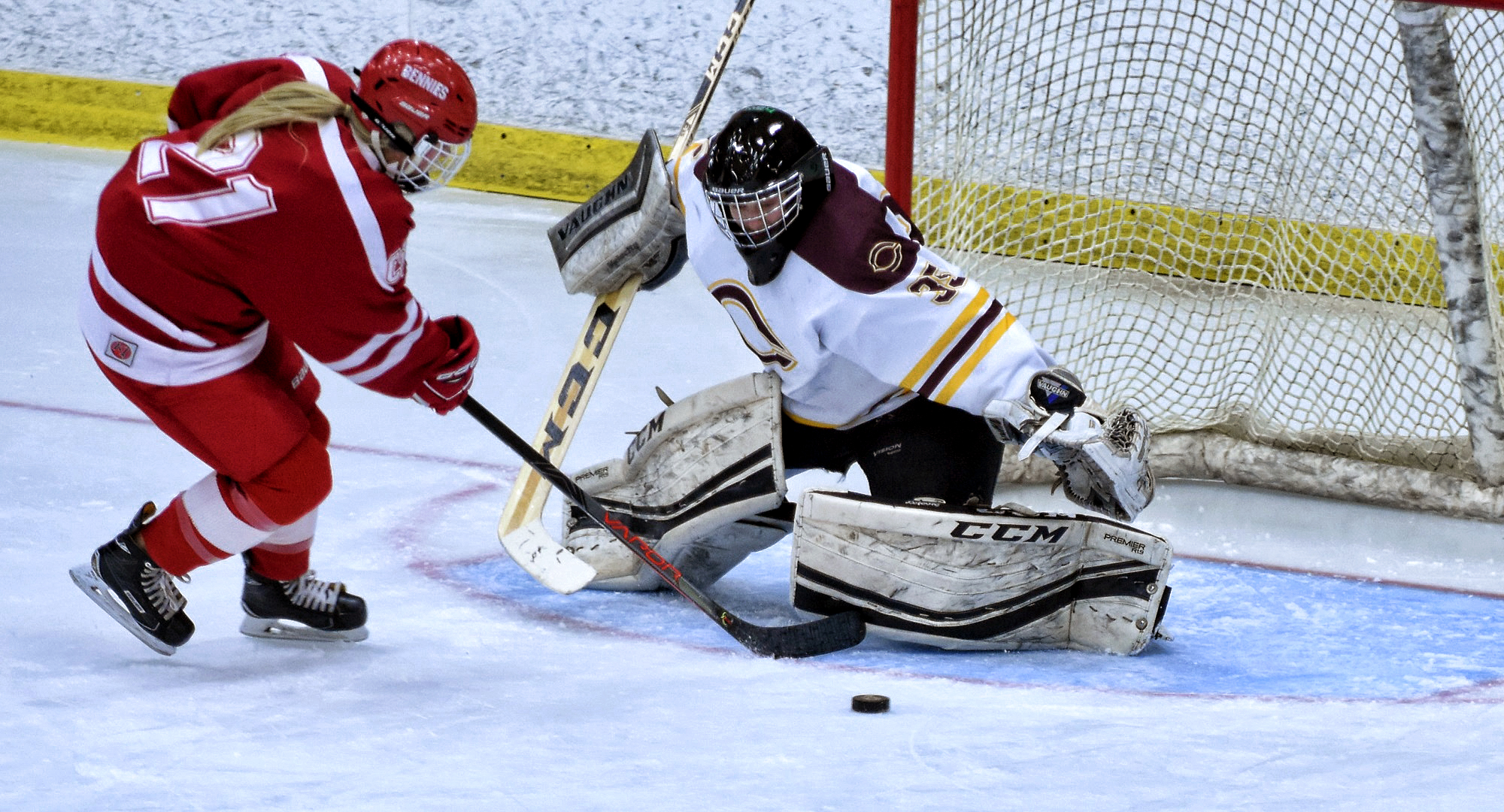 Senior goalie Amy Jost makes the save on a penalty shot in the third period of the Cobbers' series opener with St. Benedict.