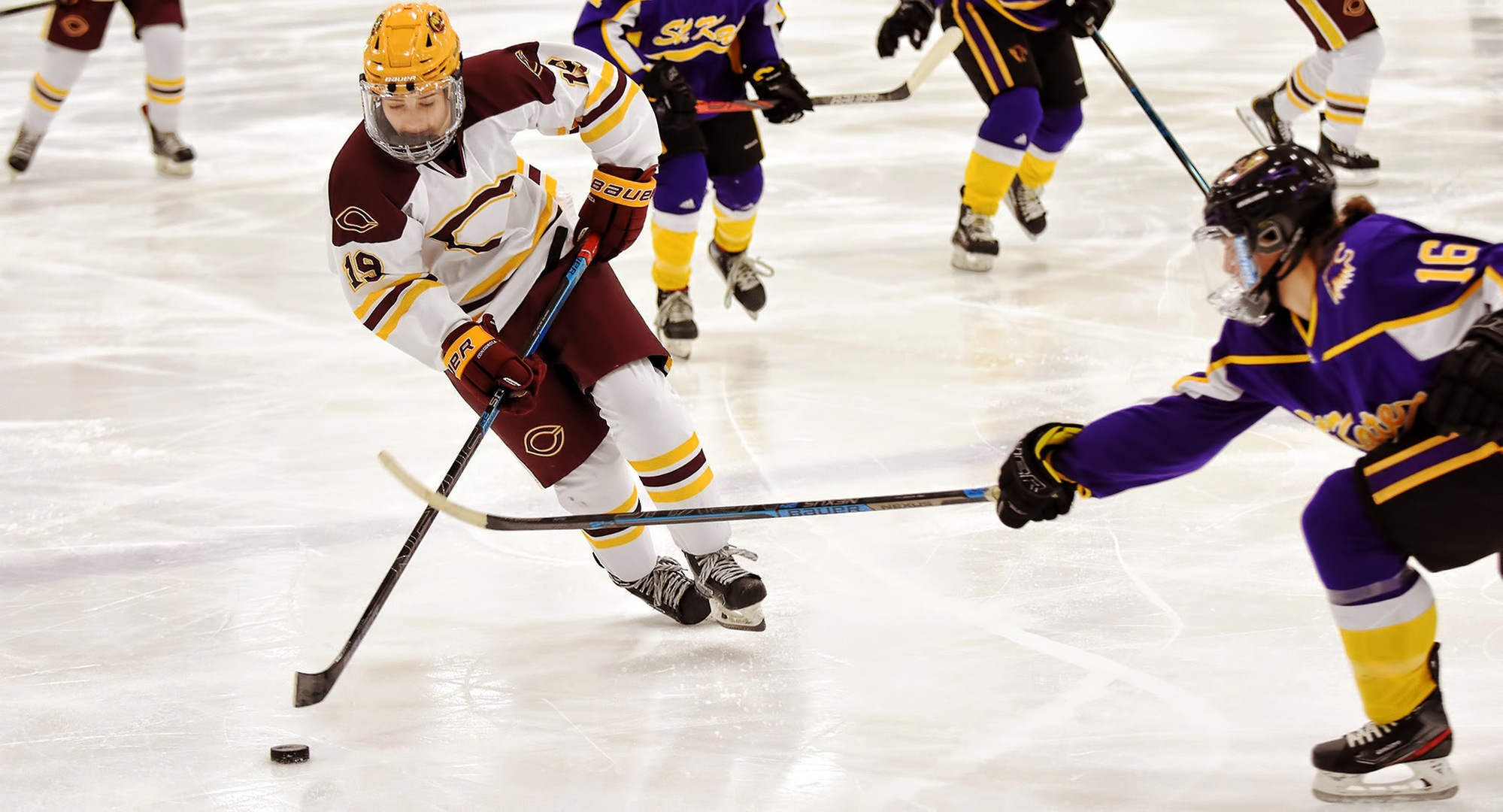 Freshman Kenley Anderson rushes the puck up the ice in the second period of the Cobbers' game with St. Kate's. Anderson scored her first collegiate goal in the win.