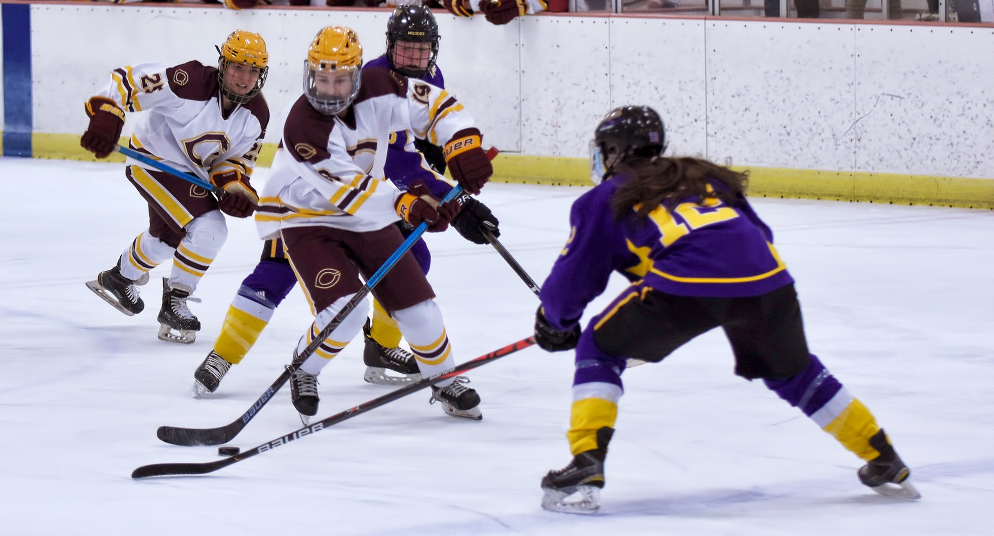 The Cobbers bring the puck up the ice during their series finale with St. Kate's.