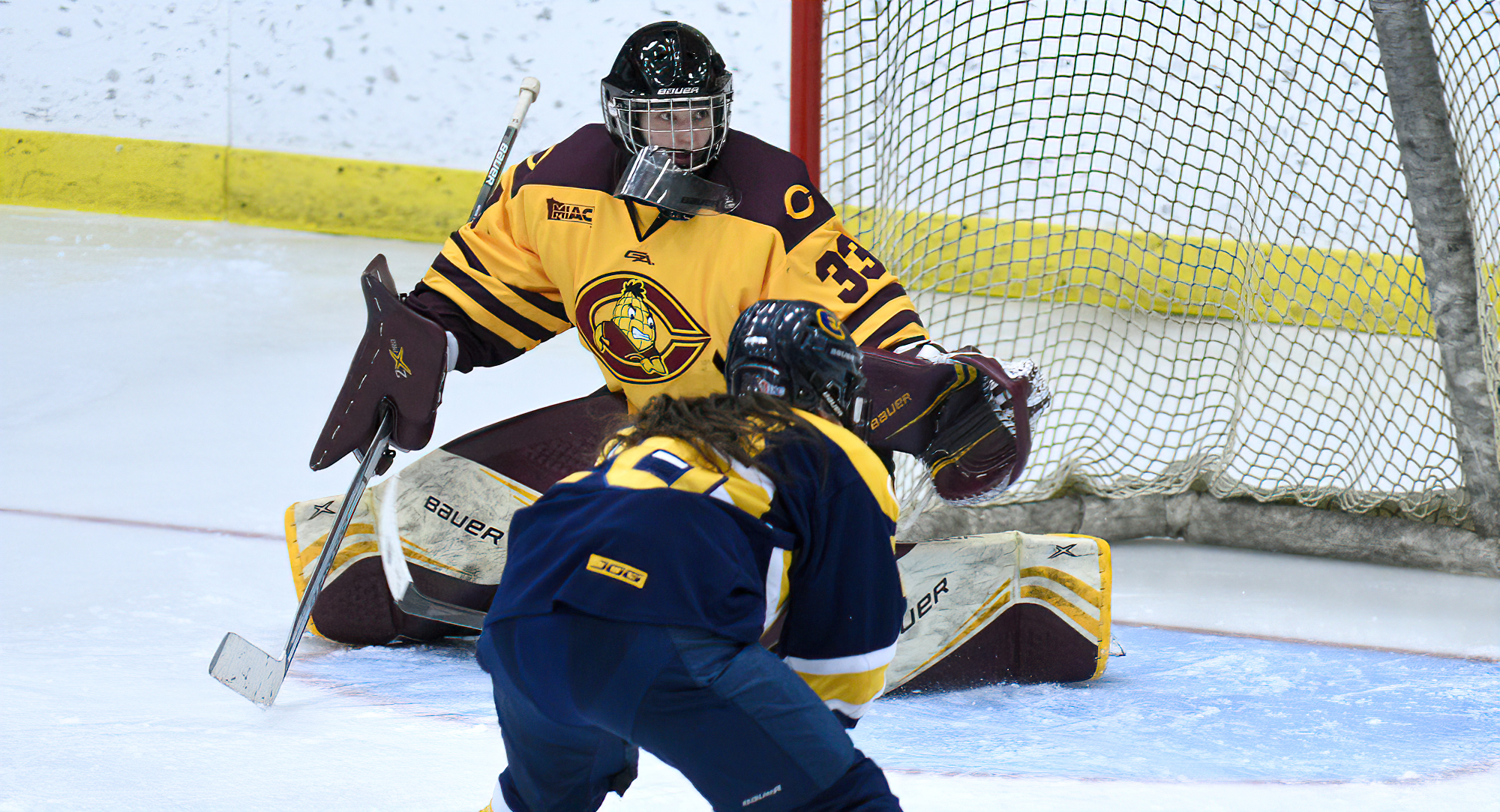 Becca Macklin watches a puck sail wide of the goal during the third period in CC's game with UW-Eau Claire. Macklin made a career-high 31 saves.