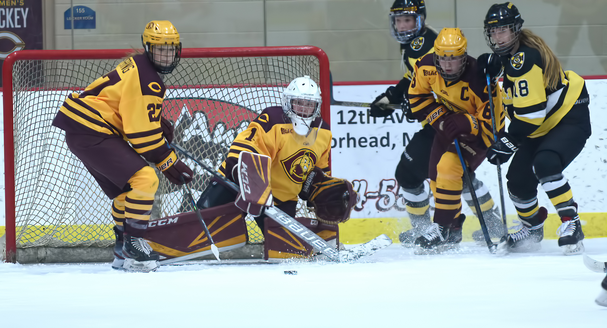 Cobber goalie Kiana Flaig watches the puck after making one of her season-high 39 saves in the Cobbers' game with No.6-ranked Gustavus.