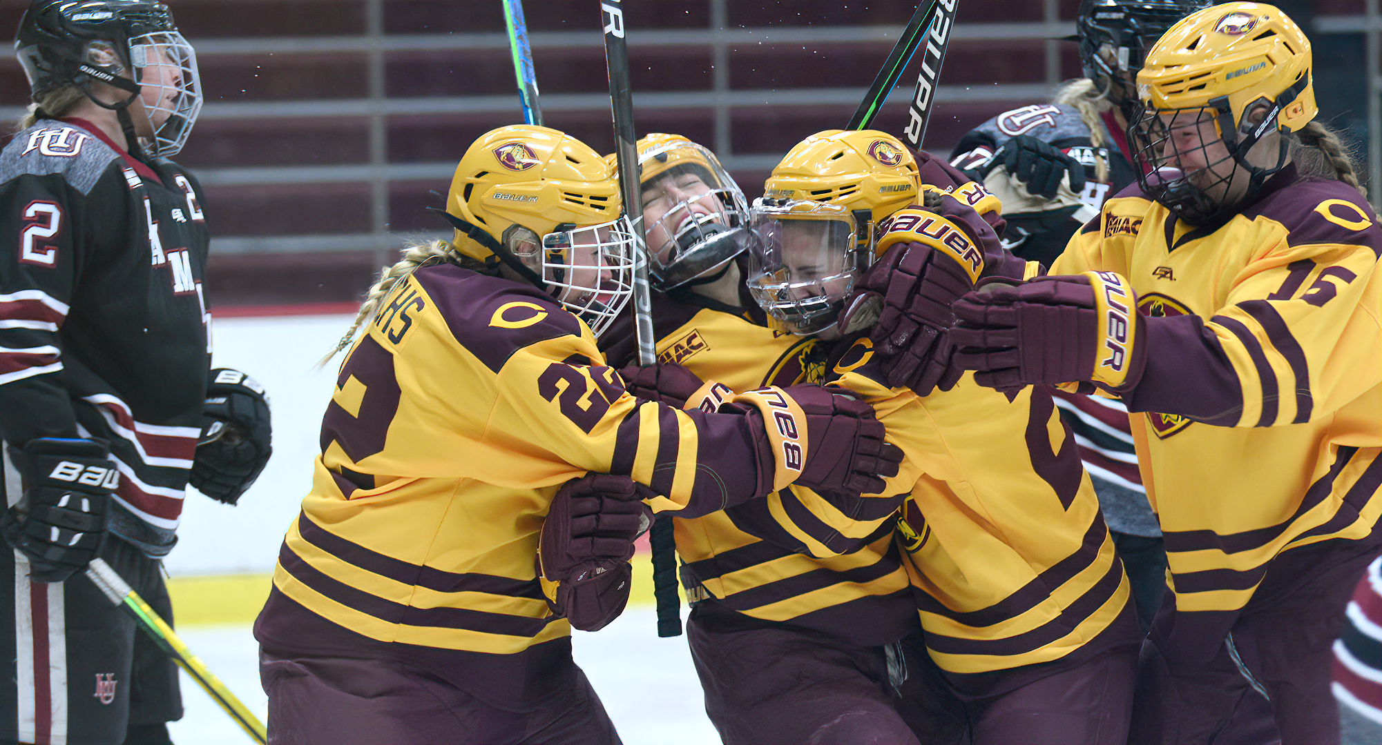 Sophomore Ellie Brewer gets surrounded by her teammates after she scored her first college goal in the Cobbers' series opener with Hamline.