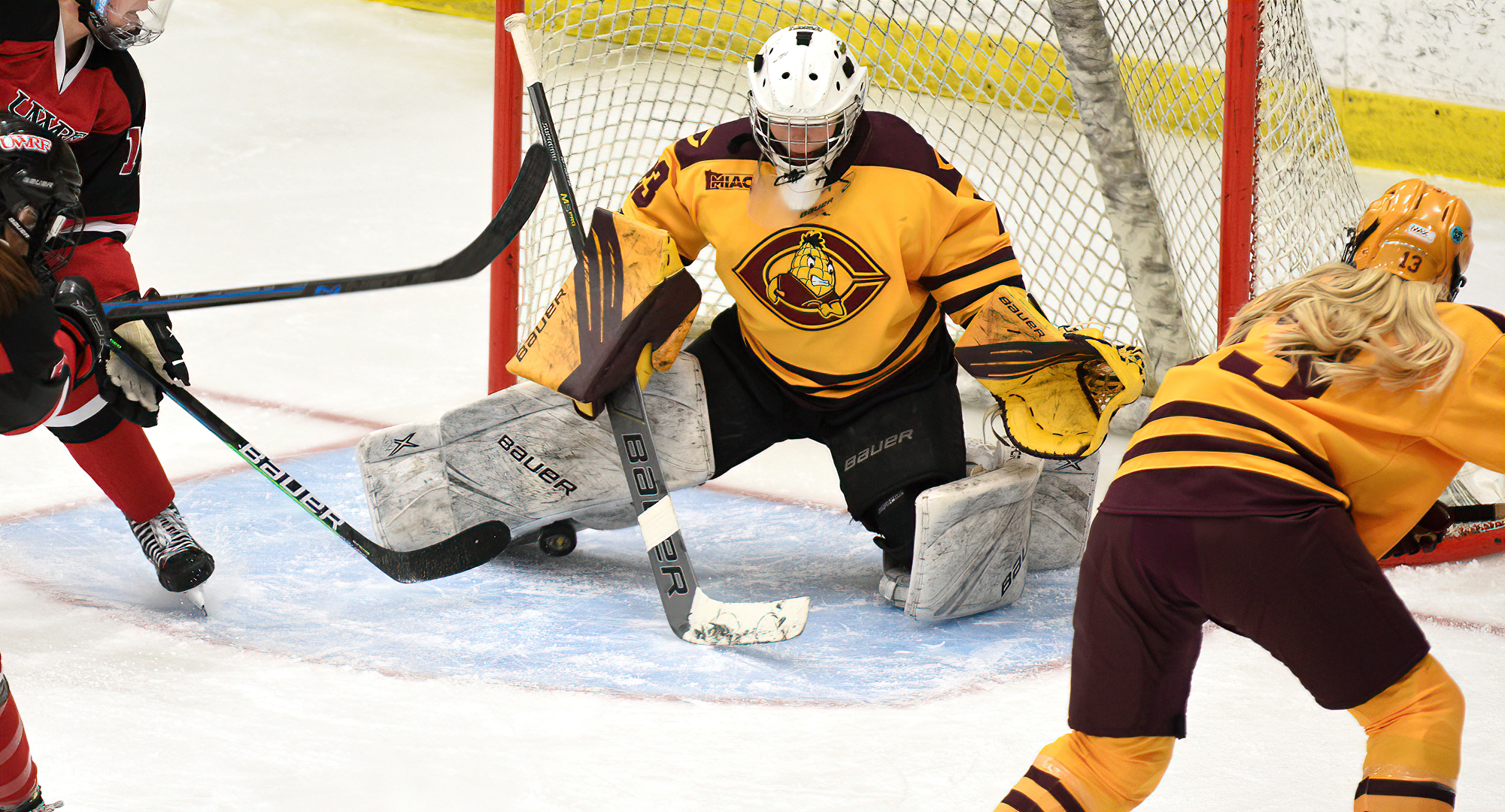 Freshman goalie Hailee Bailey makes one of her 27 saves in the Cobbers' series finale with No.2-ranked Wis.-River Falls.