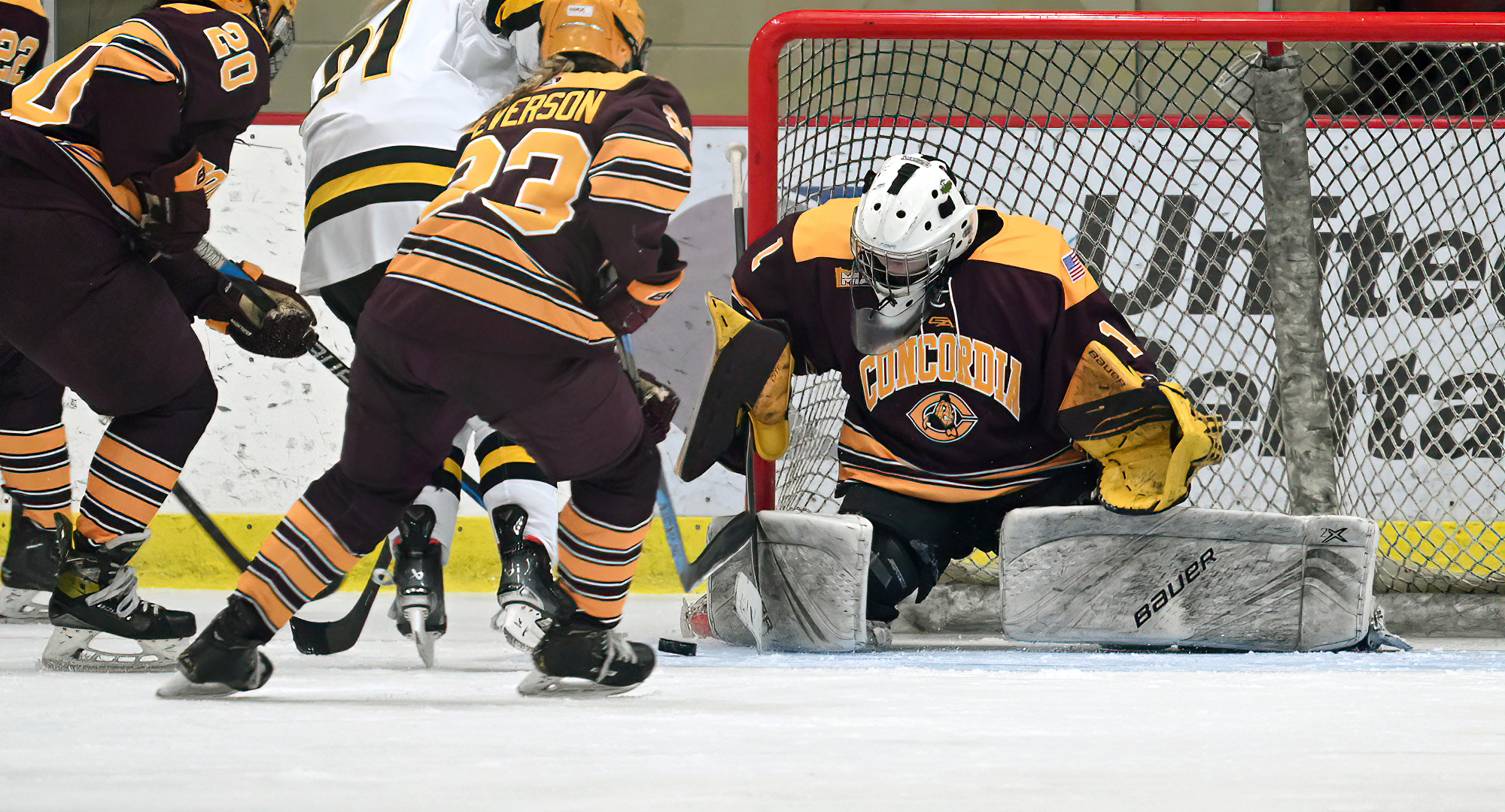 Sophomore goalie Hailee Bailey makes one of her 24 saves in the Cobbers' new uniforms during the team's 7-3 win over UW-Superior