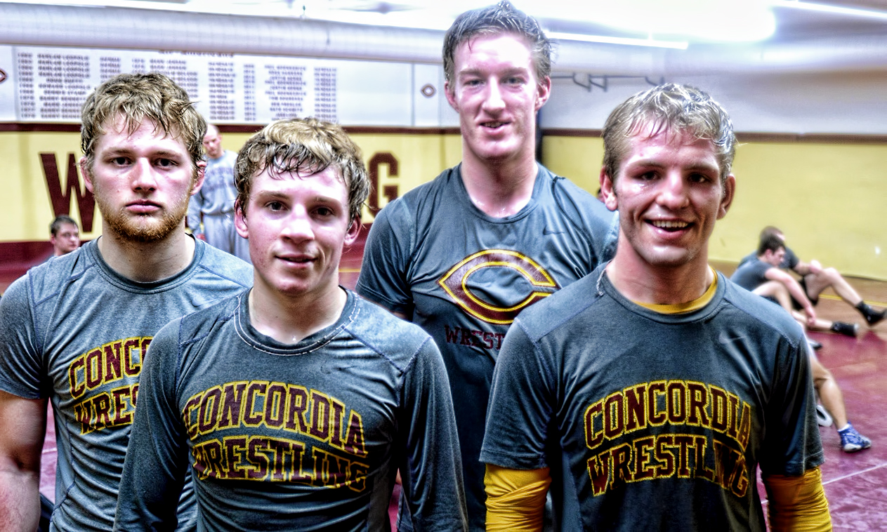 Seniors (L-R): Will McCarthy, Gabe Foltz, Zach Barber and Ben Cousins were honored before the Cobbers' dual with St. John's. CC won the dual 29-9.
