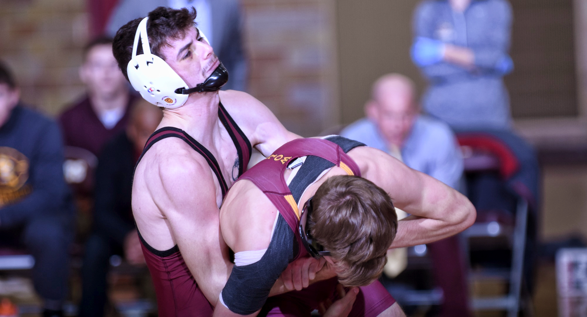 Junior Cole Kubesh takes the upper hand in his bout at 125 against Northern State. He went on to record the only pin of the night for either team.