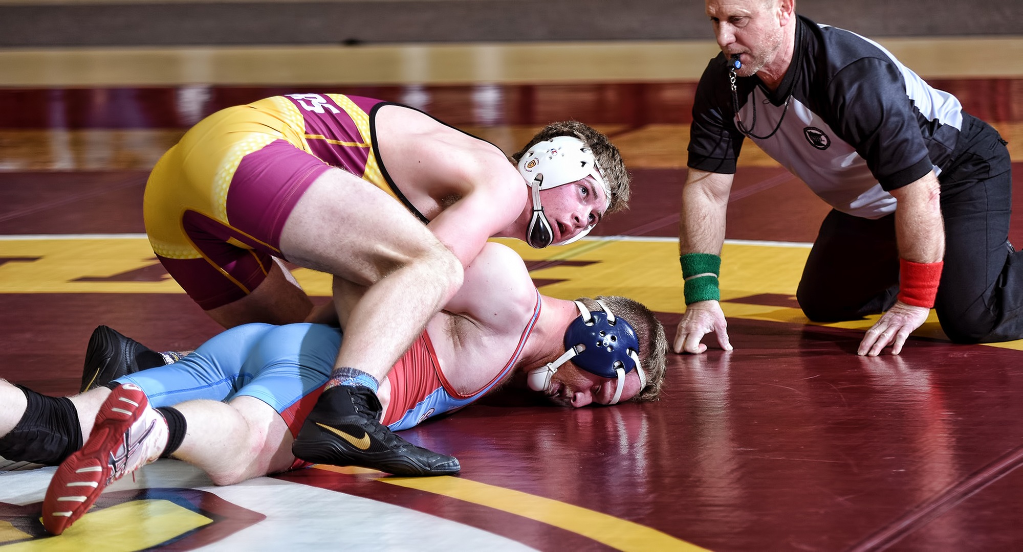 Freshman Ayden Friese gets the upper hand in his match at 184 in the Cobbers' dual with St. John's. He went on to record a 14-6 major decision and help CC beat SJU 36-12