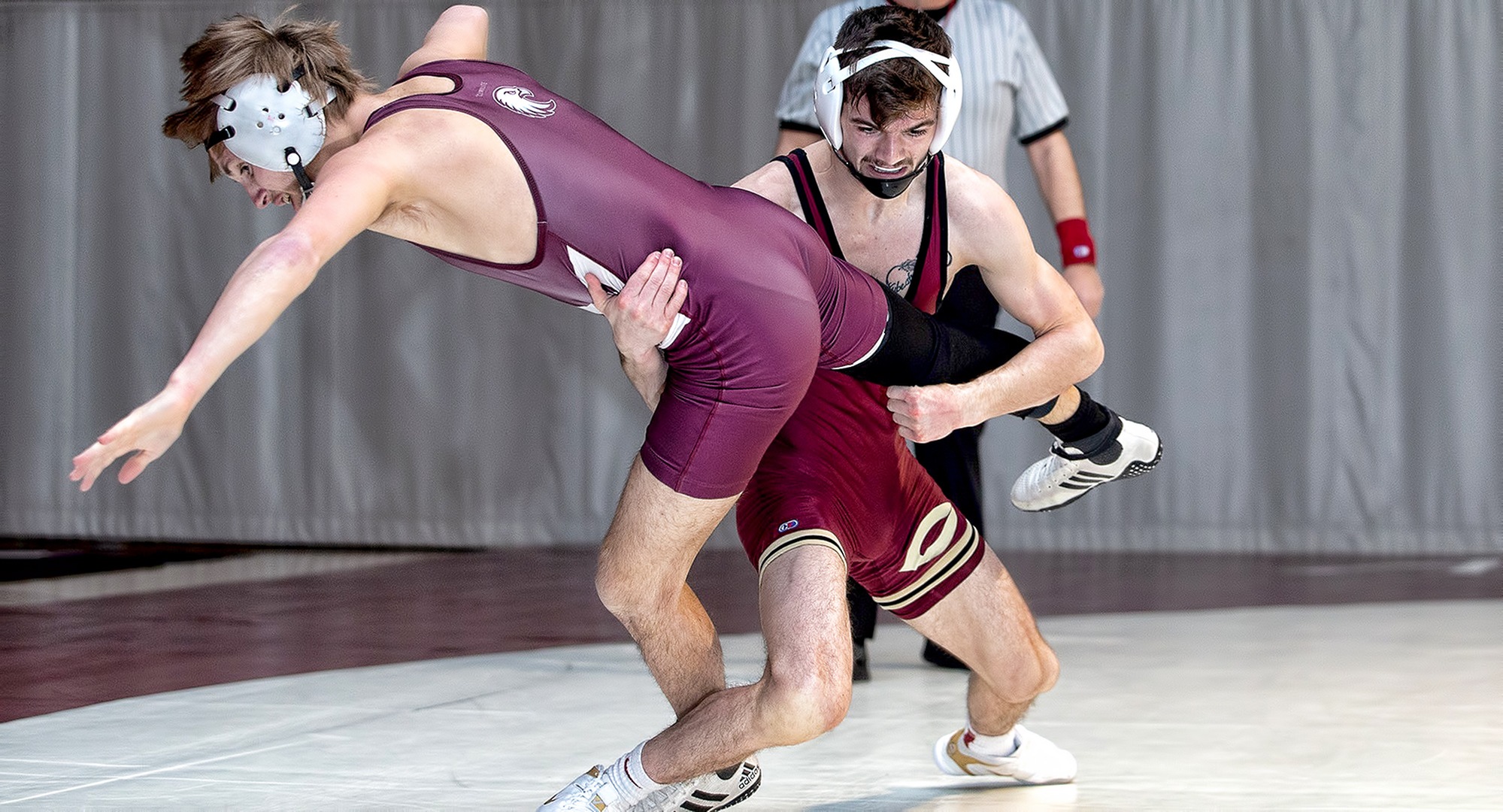 Junior Cole Kubesh gets the takedown in the first period of his match at 125 in the Cobbers' dual at No.2-ranked Augsburg (Picture courtesy of Caleb Williams, calebwilliamsphotography.com)