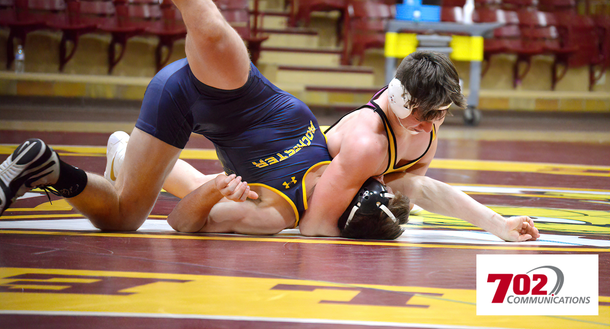 Tyler Bents gets his nationally-ranked opponent in a headlock during his match at 165 during the Cobbers' dual with RCTC.
