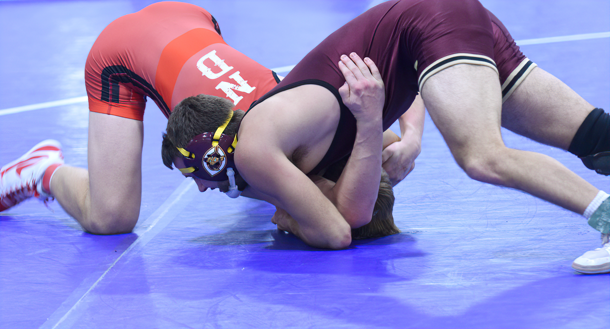 Sam Kulseth goes for the takedown during his come-from-behind win in the semifinal match at 141 in the maroon division in the Cobber Open.