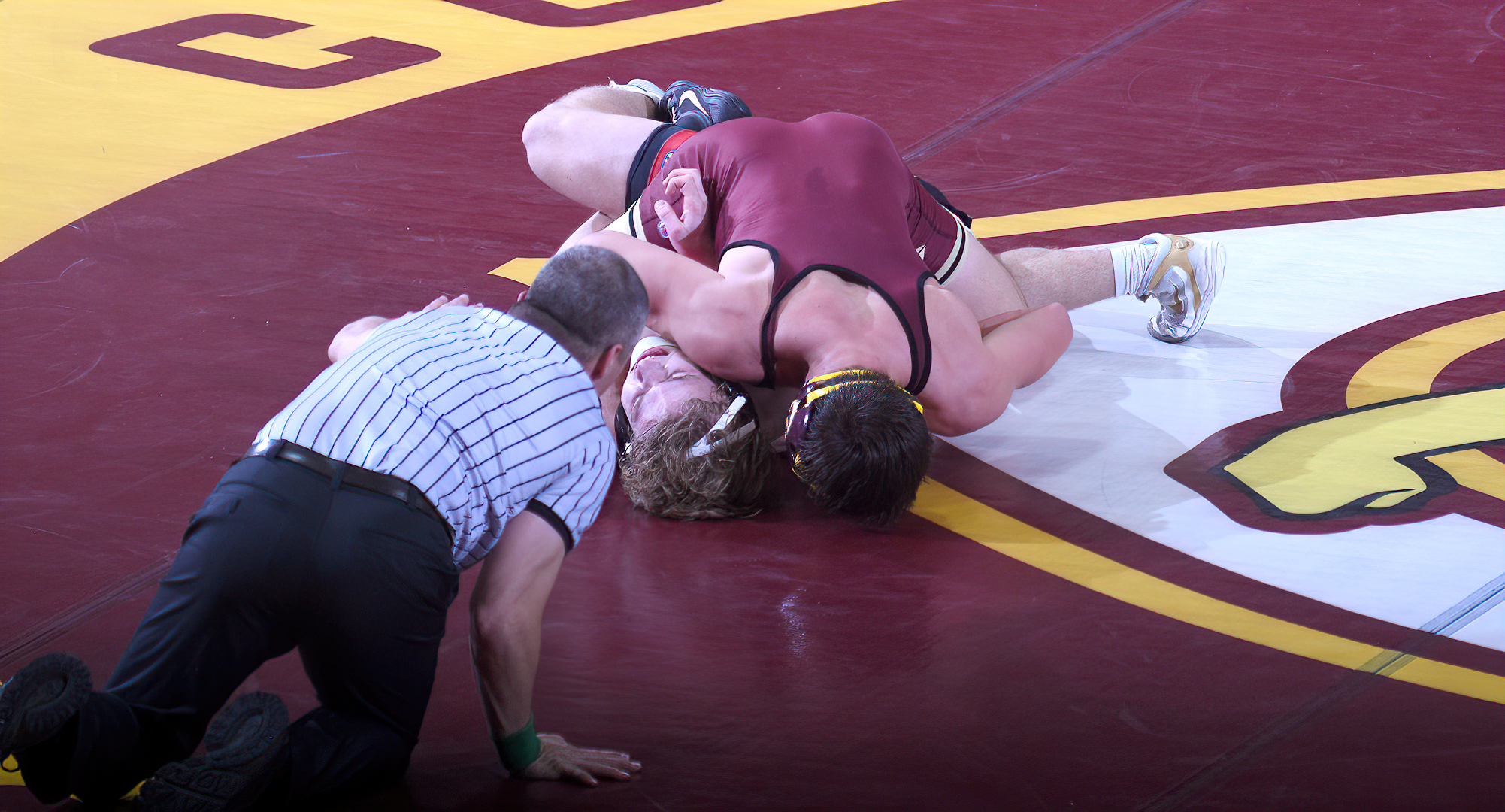 Junior Tyler Bents sticks his opponents shoulders on the mat on his way to a late-match pin at 157 in the Cobbers' 31-6 win over MSU Moorhead.