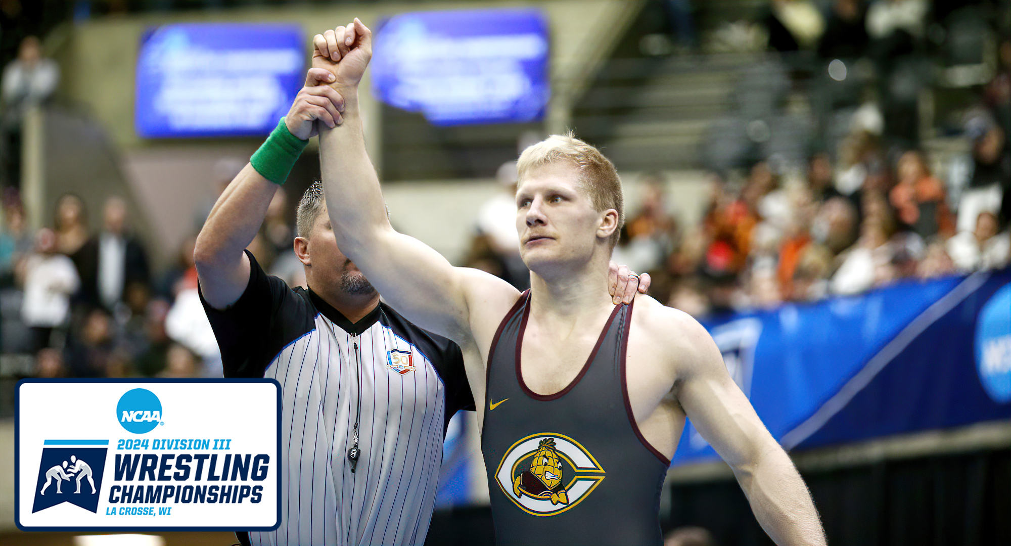 Gabe Zierden gets his hand raised after winning the semifinal match at the NCAA National Meet.