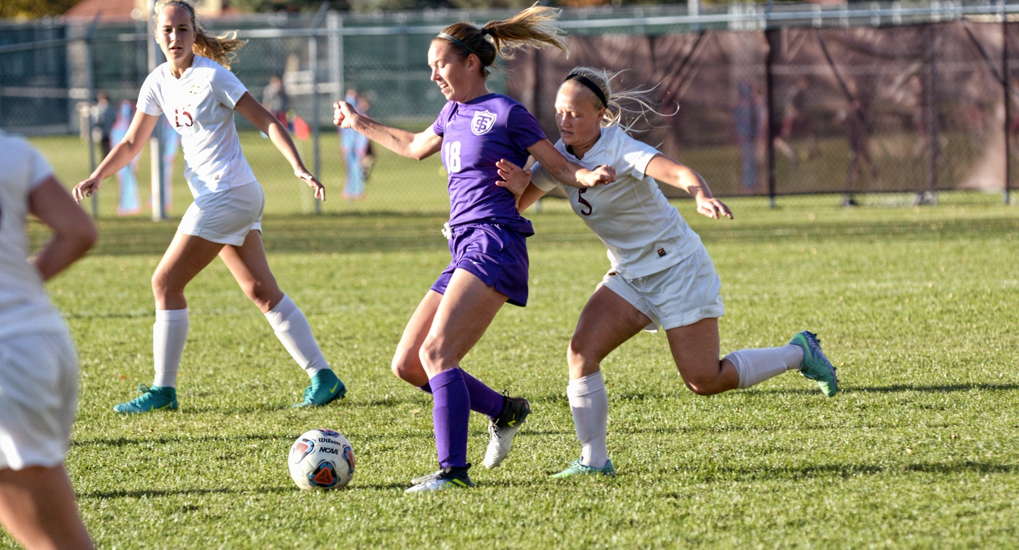 Defender Erin Eidsness tries to step up and win the ball during the Cobbers' game with regionally-ranked St. Thomas.