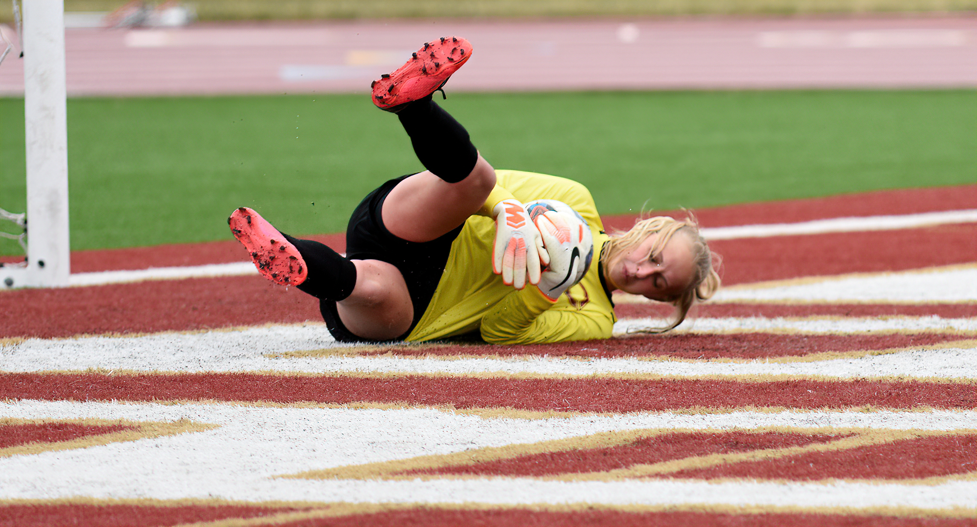 Freshman goalie Breanna Nelson makes one of her six saves in the Cobbers' game against Augsburg on Sunday.