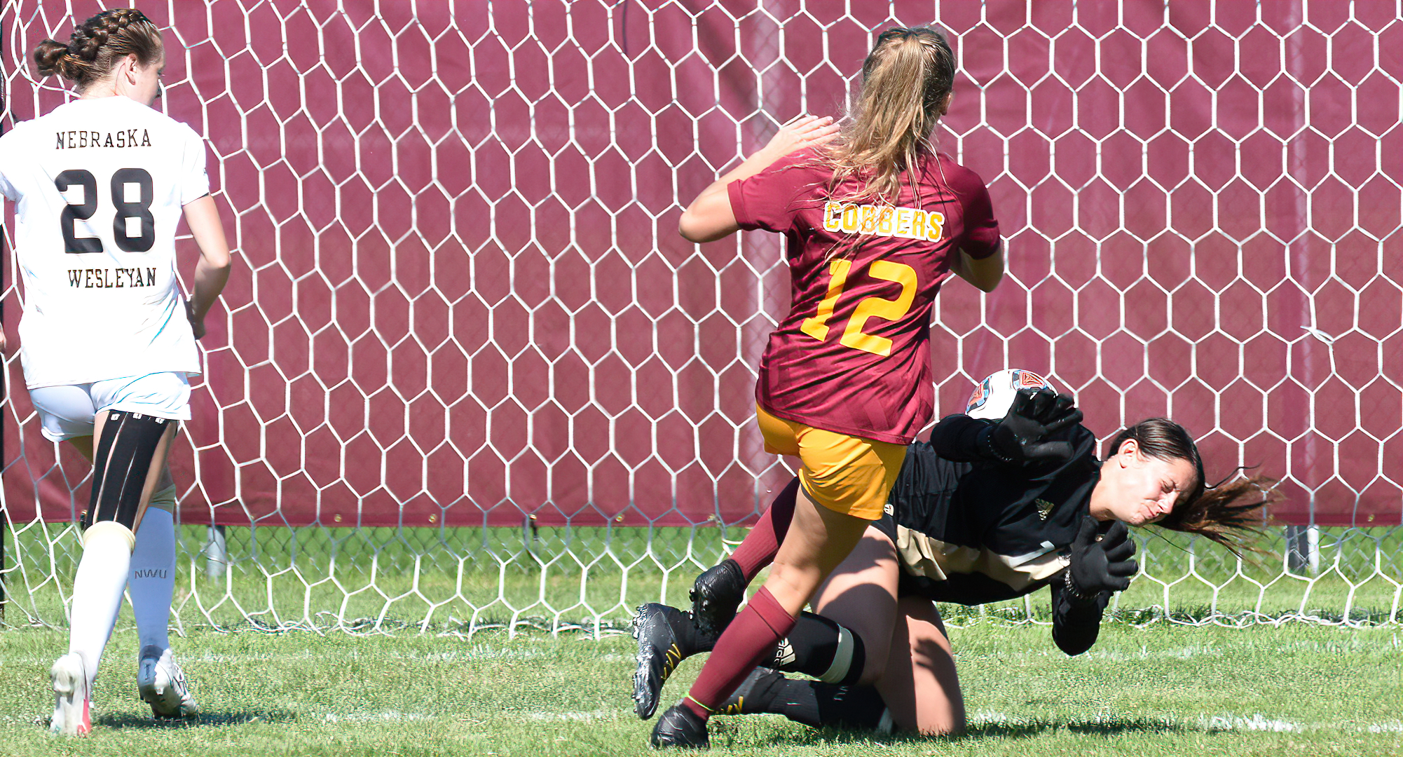 Freshman Amber Weibye sends the ball past the oncoming Neb. Wesleyan goalie for the game-winning goal in the Cobbers' 2-0 win over NWU.