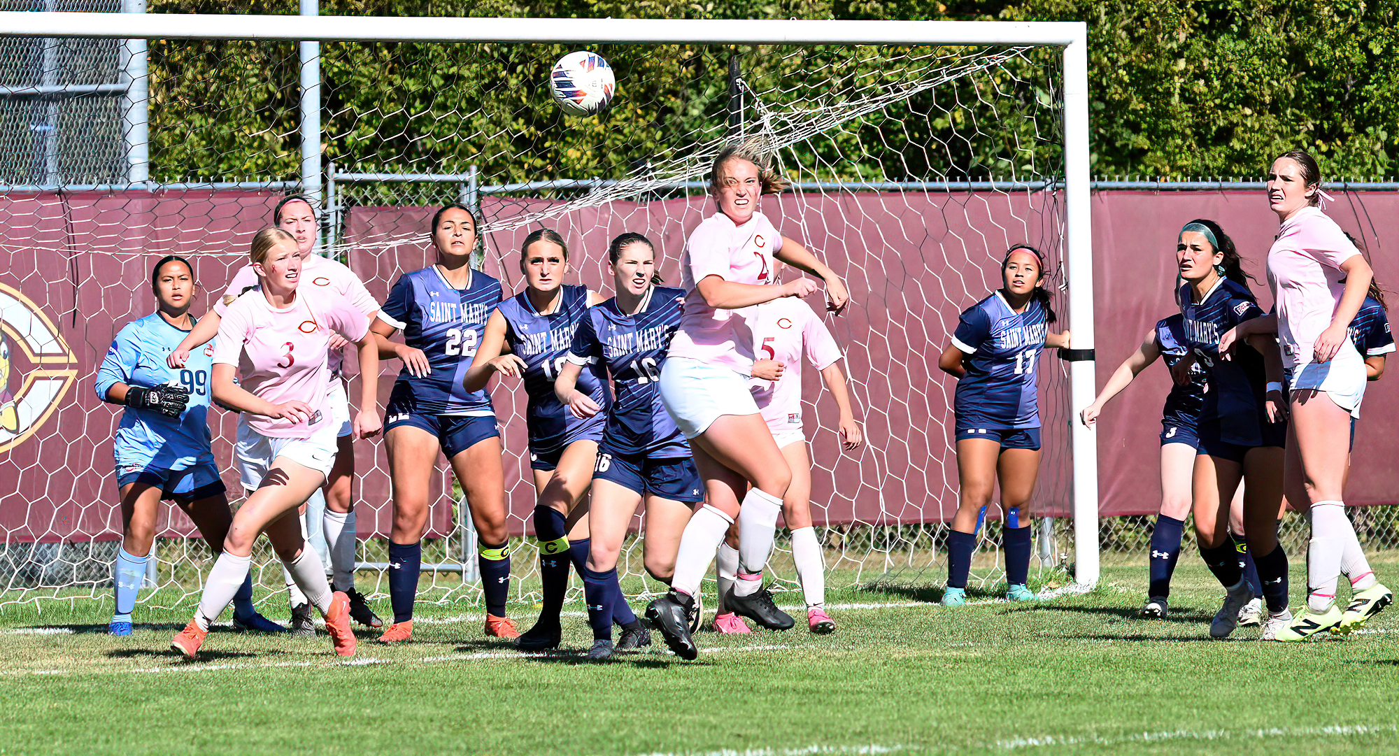 Darby Hanna (#24) and Maggie Barker (#3) scramble for the ball inside the St. Mary's penalty area in the Cobbers' game with the Cardinals.