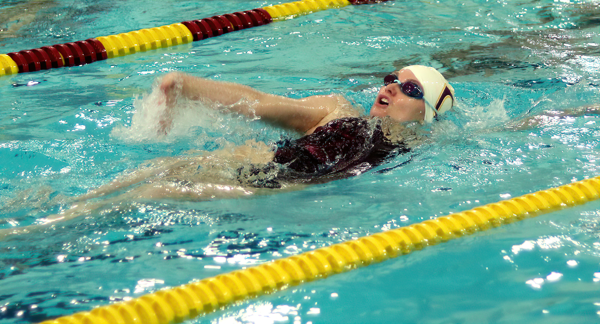 Junior Kaitlin Cramer competes in the 200-yard backstroke in the Cobbers' home opener. She finished third in the event and also won the 1000 free.