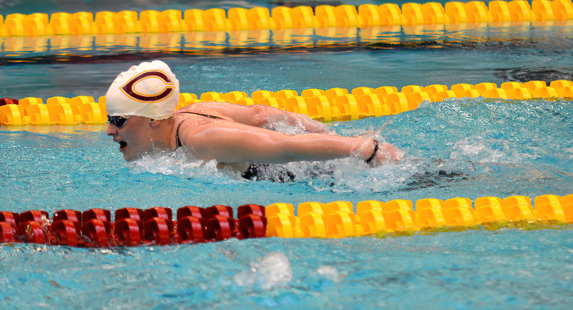 One of the Cobber swimmers comes out of the water during the prelims of the 100-yard butterfly at the MIAC Meet. (Photo courtesy of MIAC Office)