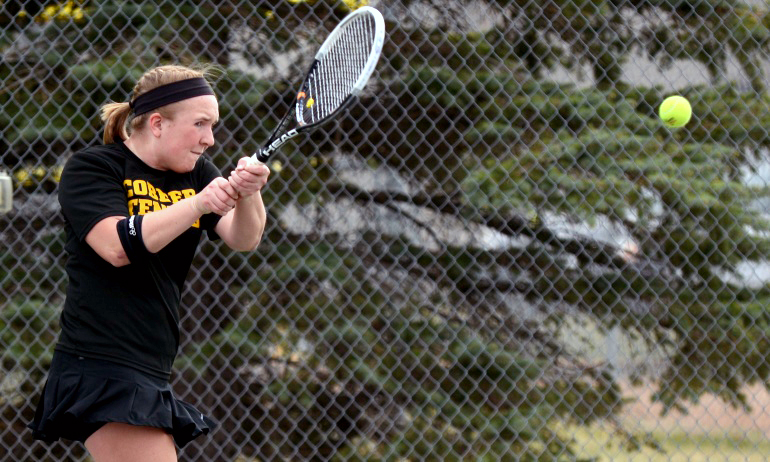 Jade Haseltine makes a backhand return of service in her No.2 singles bout against St. Cloud State.