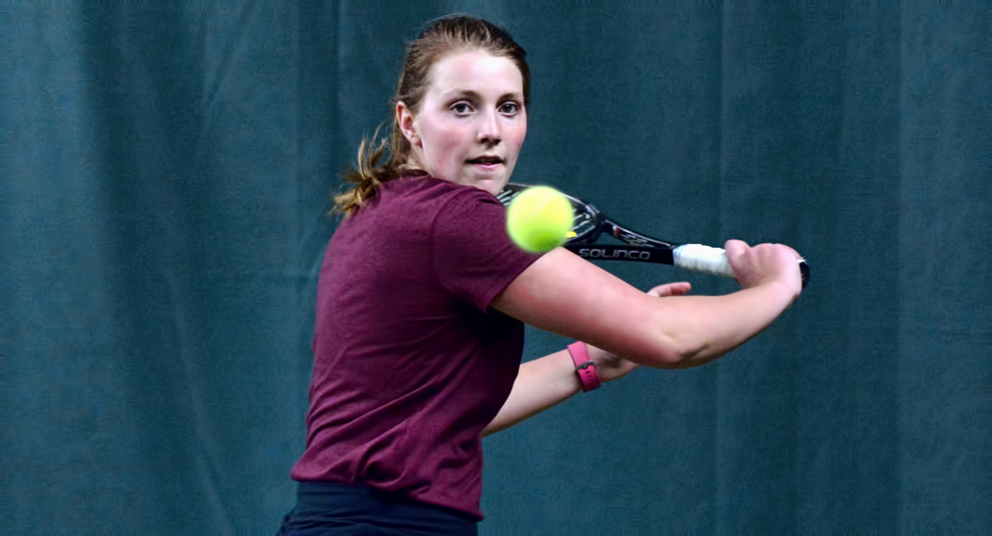 Senior Kendra Stoick focuses on the ball during her win at No.2 singles against Macalester. Stoick overcame food poisoning to win in straight sets.