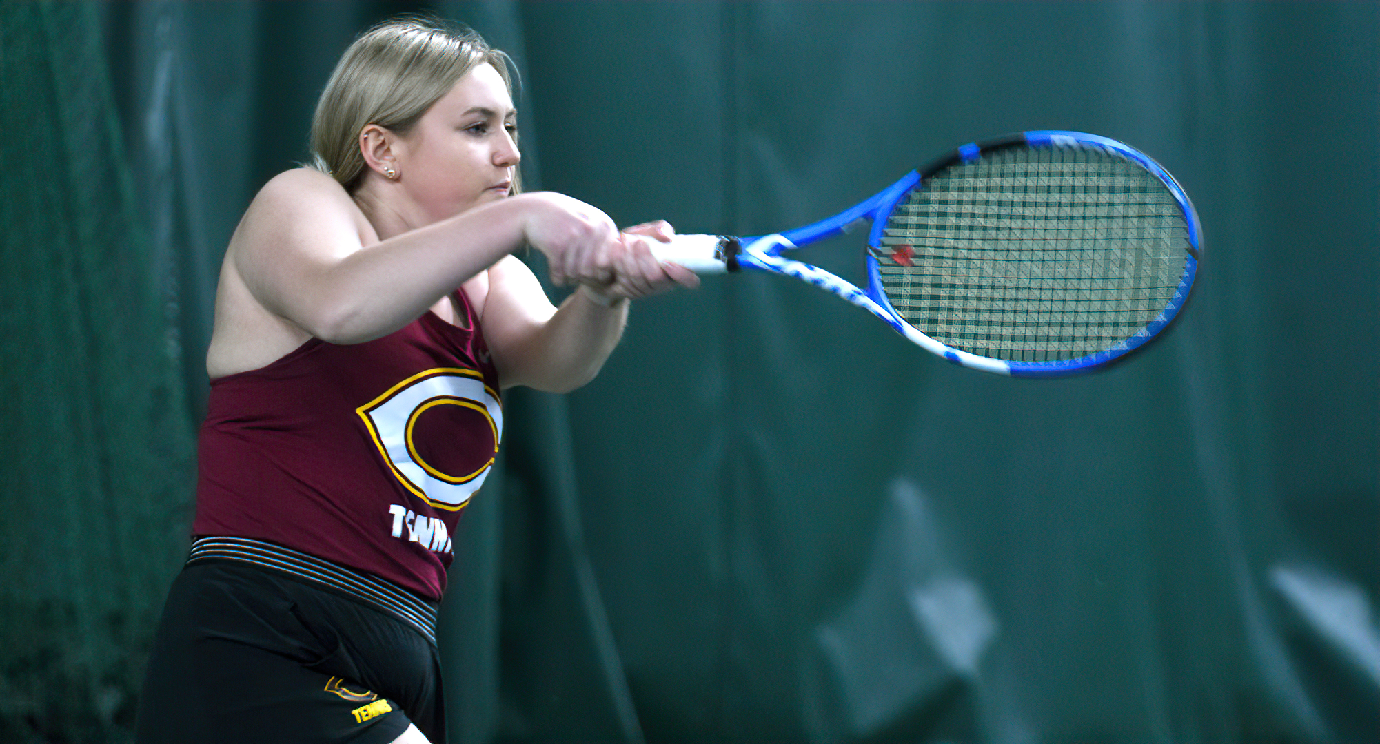 Senior Abby Westrum hits a backhand winner down the line during her singles match vs. Macalester. She won both her singles and doubles matches.