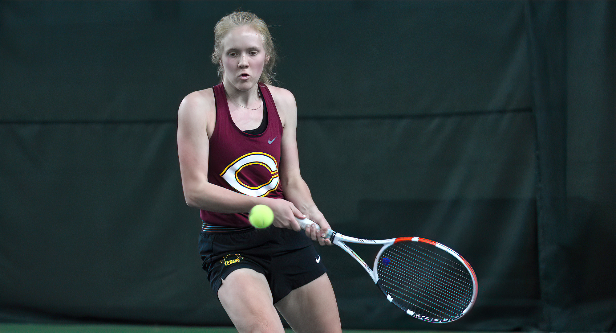Freshman Erin Borchard tracks down a volley and hits a backhand winner during the first set of her 7-5, 6-1 win at No.6 singles vs. MSUM.