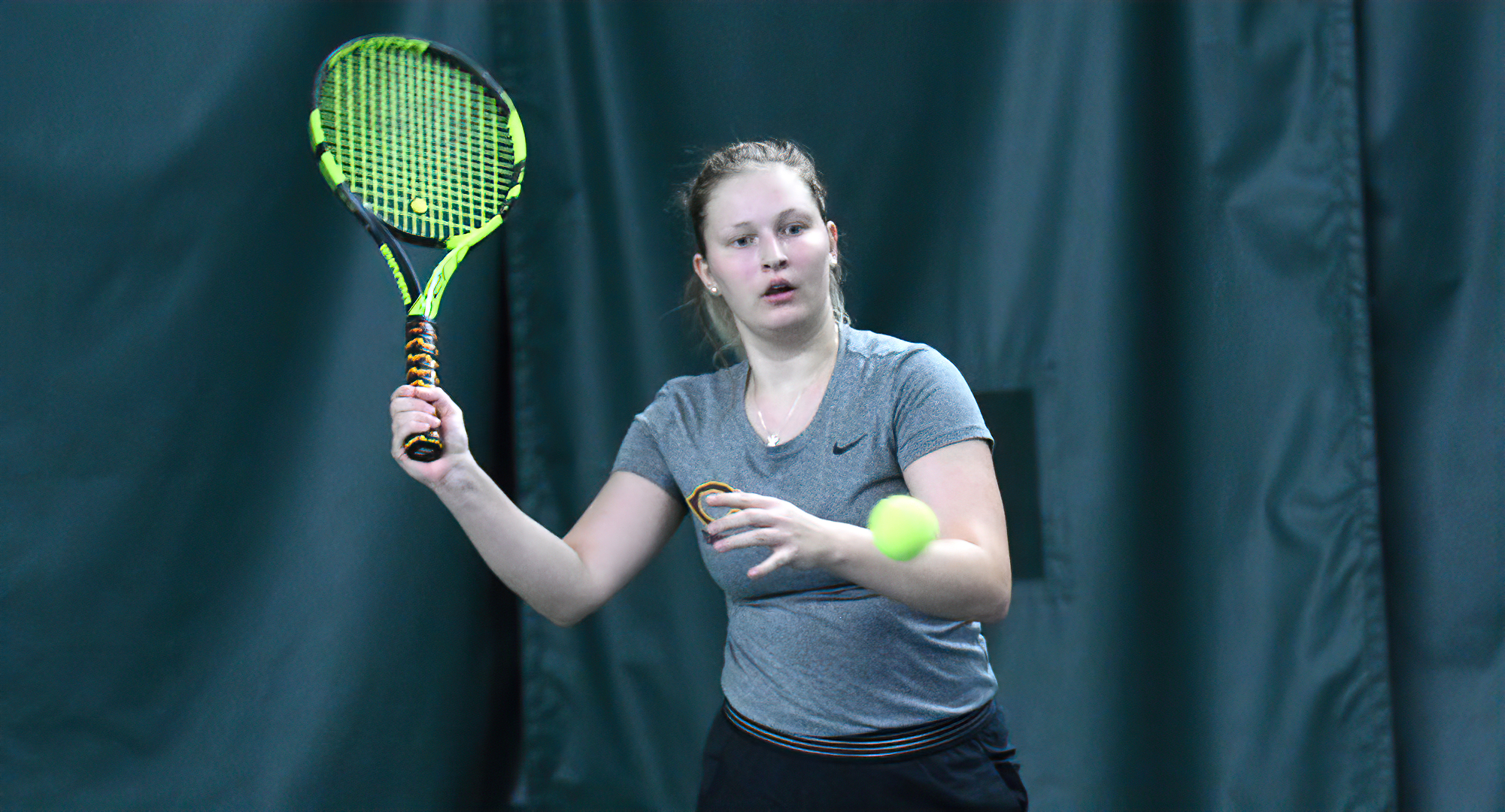 Mary Skorich eyes a forehand return during her singles match vs. St. Mary's. She won 13-11 in the super-set, tie-breaker to earn her fifth win of 2022.