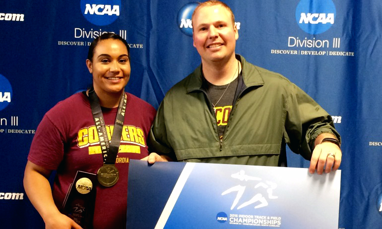 Cherae Reeves poses with Cobber throws coach Dave Reuter after winning the national championship in the shot put.