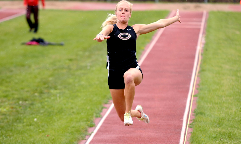 Mikayla Forness takes flight in the long jump at the MIAC heptathlon. She finished third in the event. (Photo courtesy of Carleton SID)