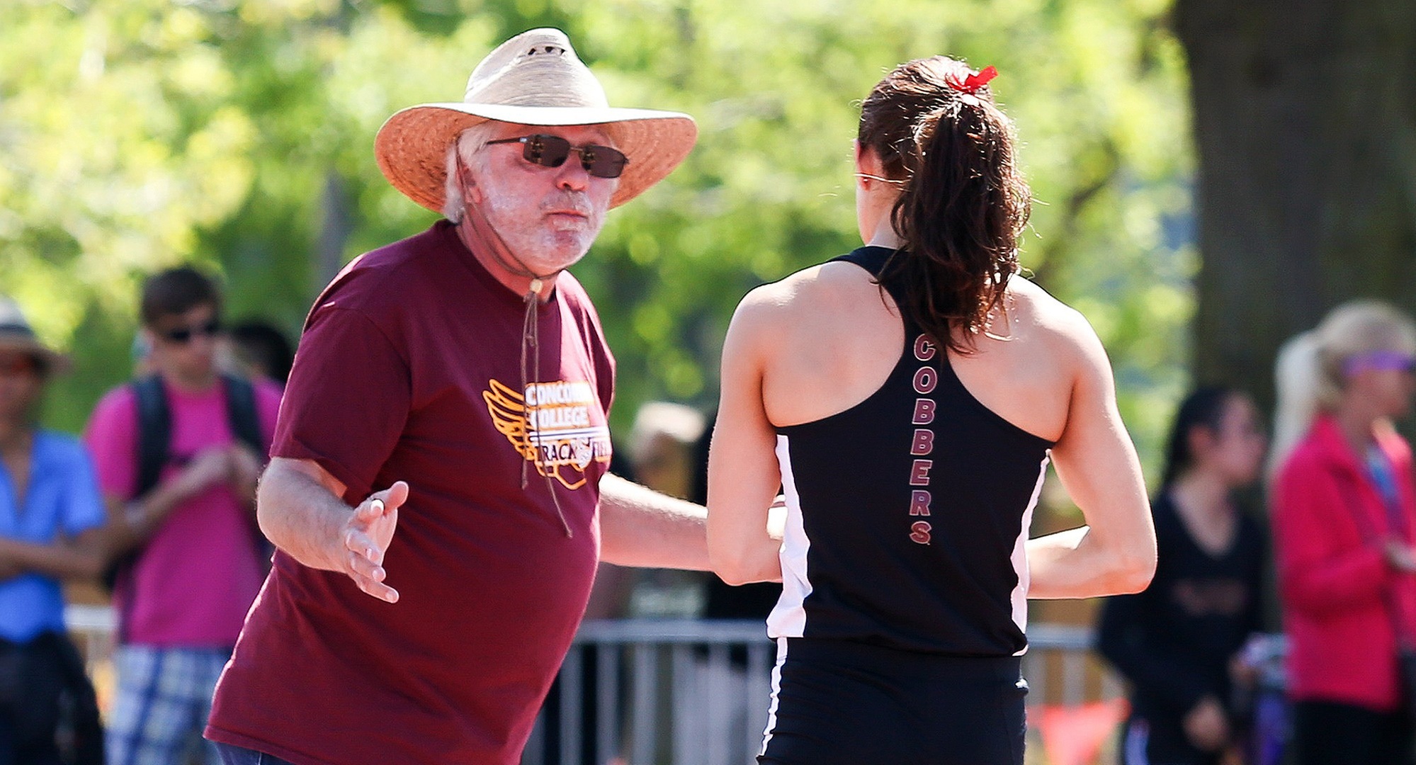 Cobber assistant coach Martin Peper (L) and Emma Peterson both earned USTFCCCA top regional honors. (Photo courtesy of Nathan Lodermeier)