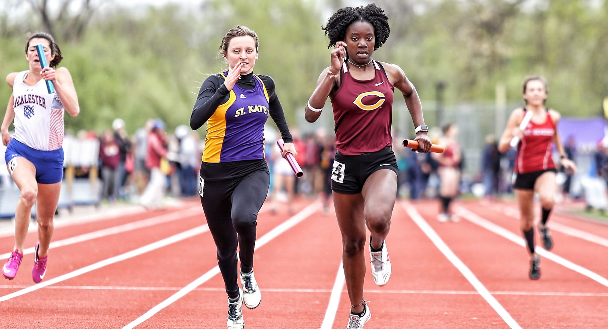 Sophomore Zahra Banks races to the finish line in the 100-meter relay on Day 2 of the MIAC Championship Meet (Photo courtesy of Nathan Lodermeier)