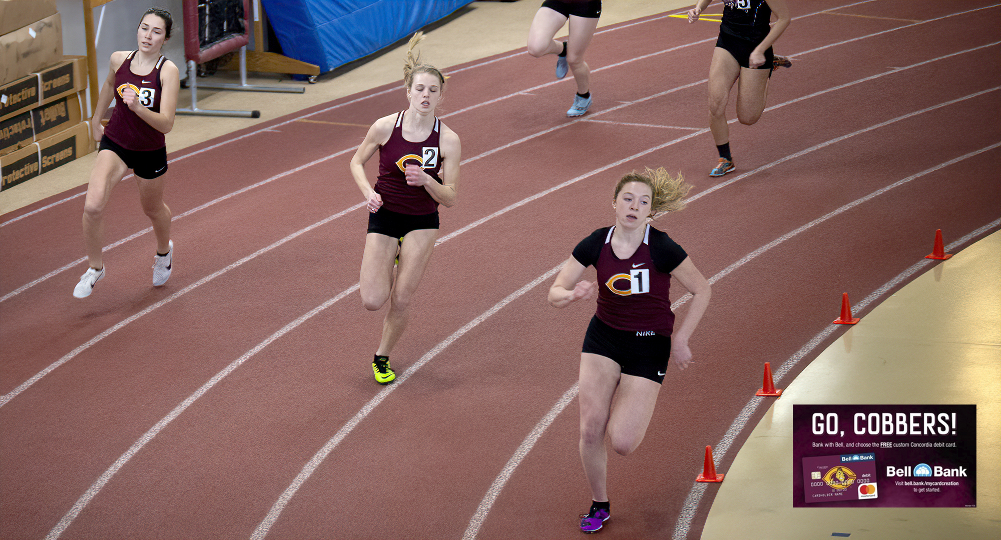 Josie Herrmann (R) leads a crew of Cobbers around the first turn at the start of the 600 meters. She won the 600 and the 800 at the home-opening dual meet.