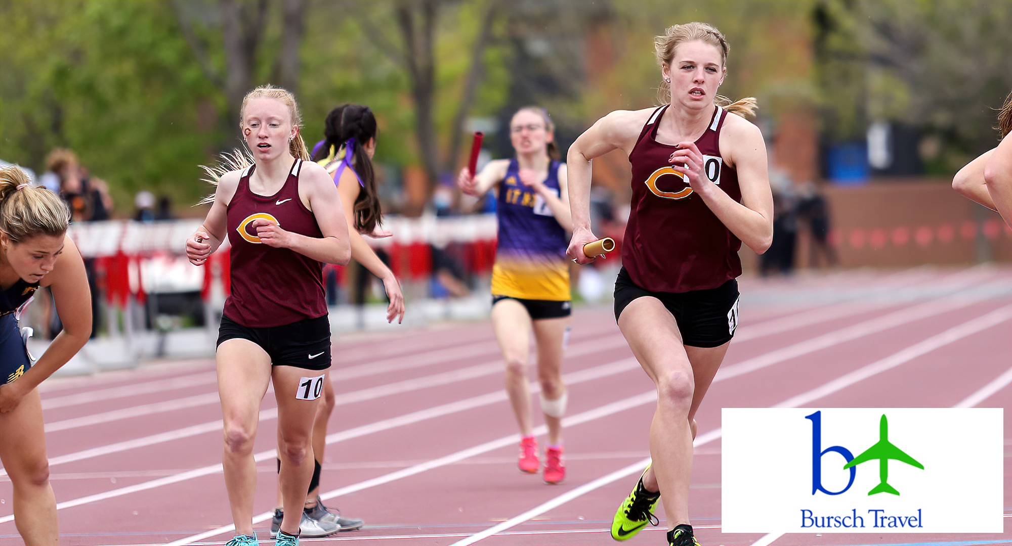 Freshman Maddie Guler (L) finishes the first leg of the 4x800-meter relay and passes the baton to Carly Fornshell. The CC team would go on to finish seventh in the race. (Photo courtesy of Nathan Lodermeier)