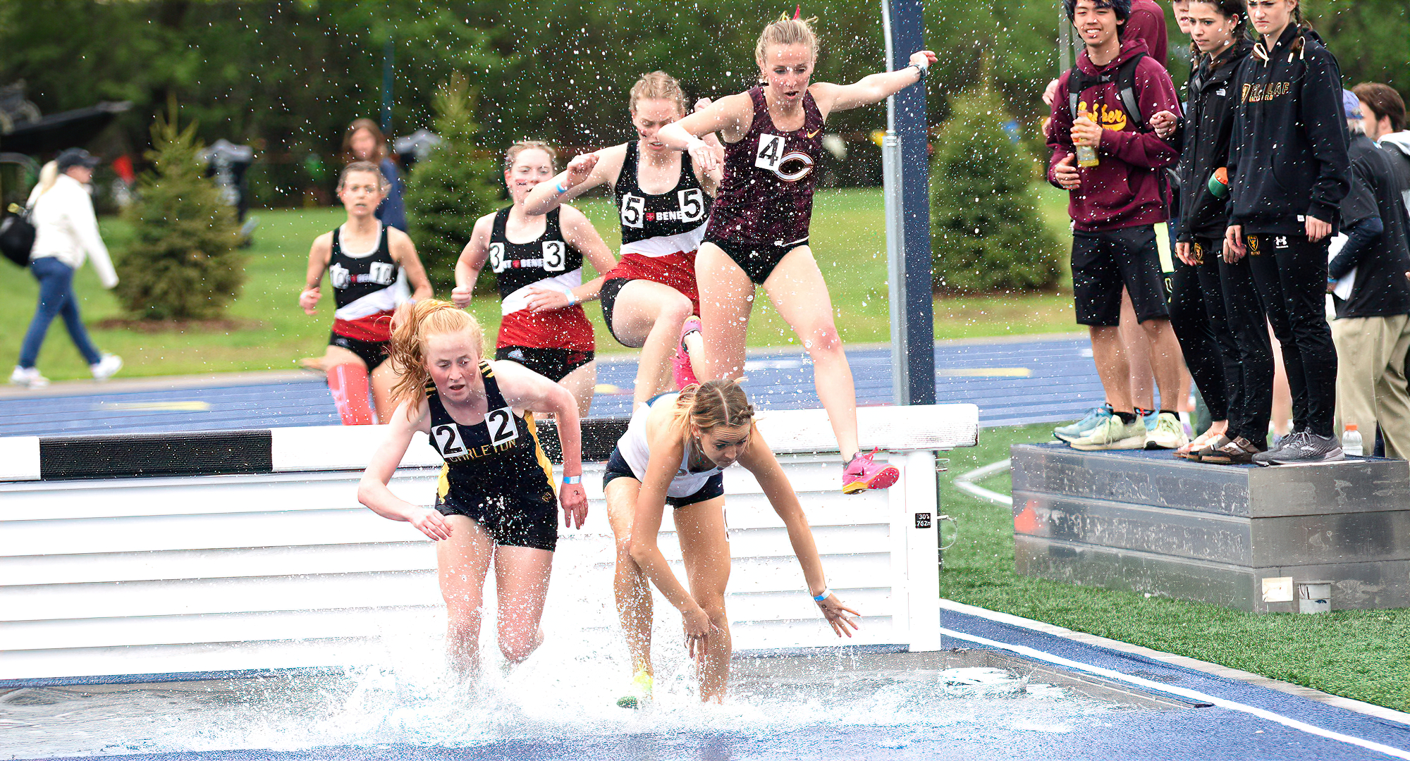 Emily Rugloski tries to avoid a pair of runners, in the 3000-meter steeplechase. She posted the fourth fastest time in CC history in the event.