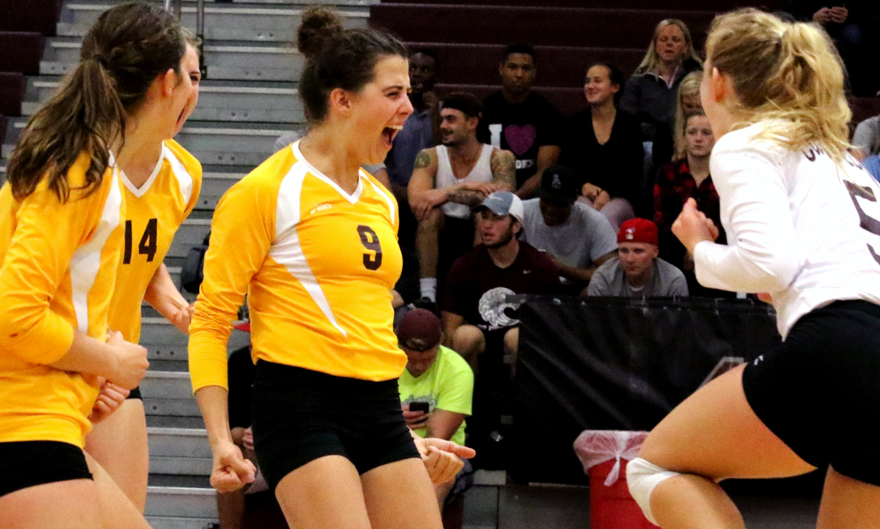 Heather Beaner leads the celebration during the Cobbers' upset sweep over #19 Augsburg. (Photo courtesy of Don Stoner - Augsburg SID)