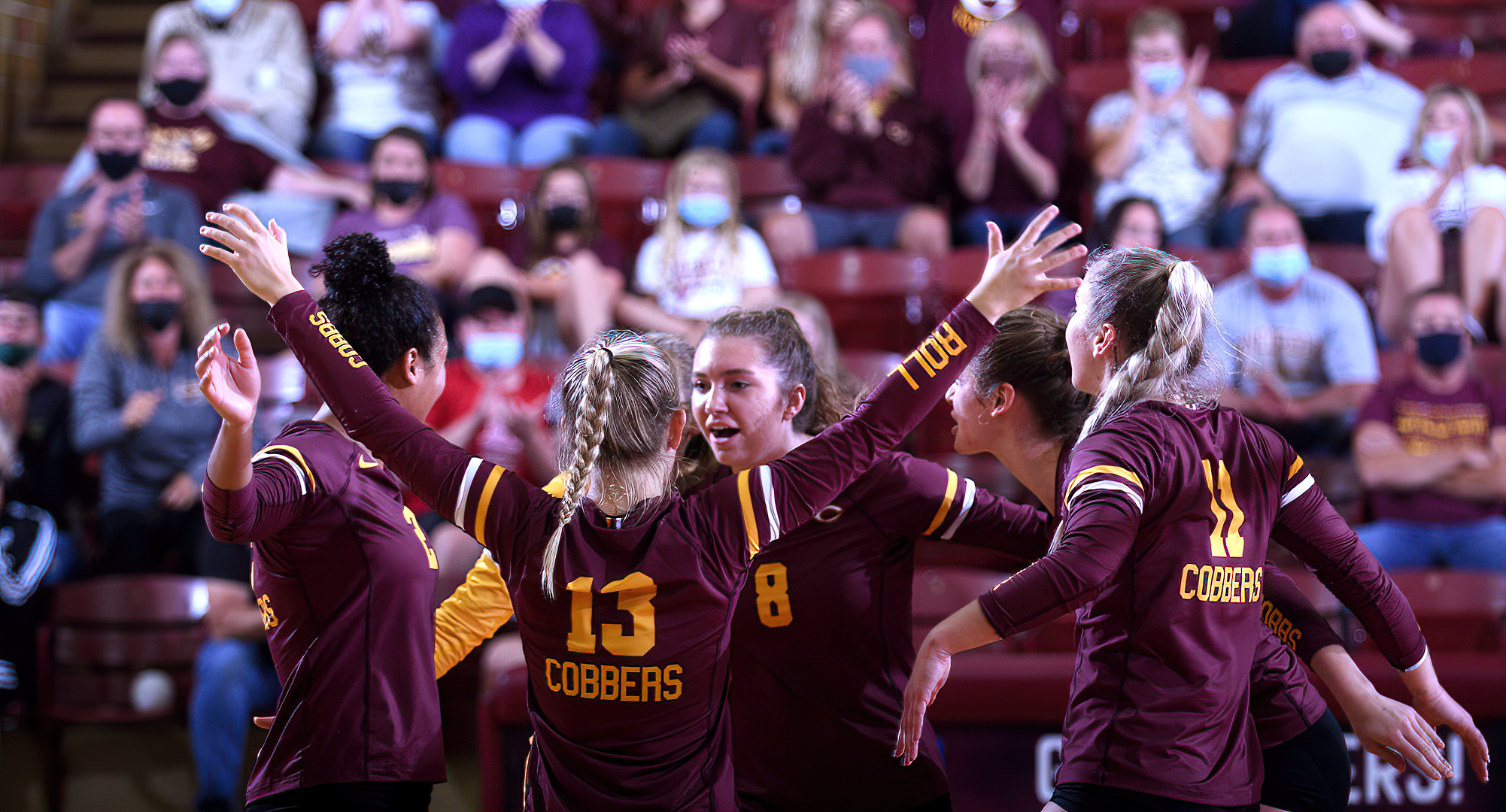 Concordia celebrates being back in front of fans during their home opener with Augsburg.  CC played a spirited first set, but ended up losing 3-0.