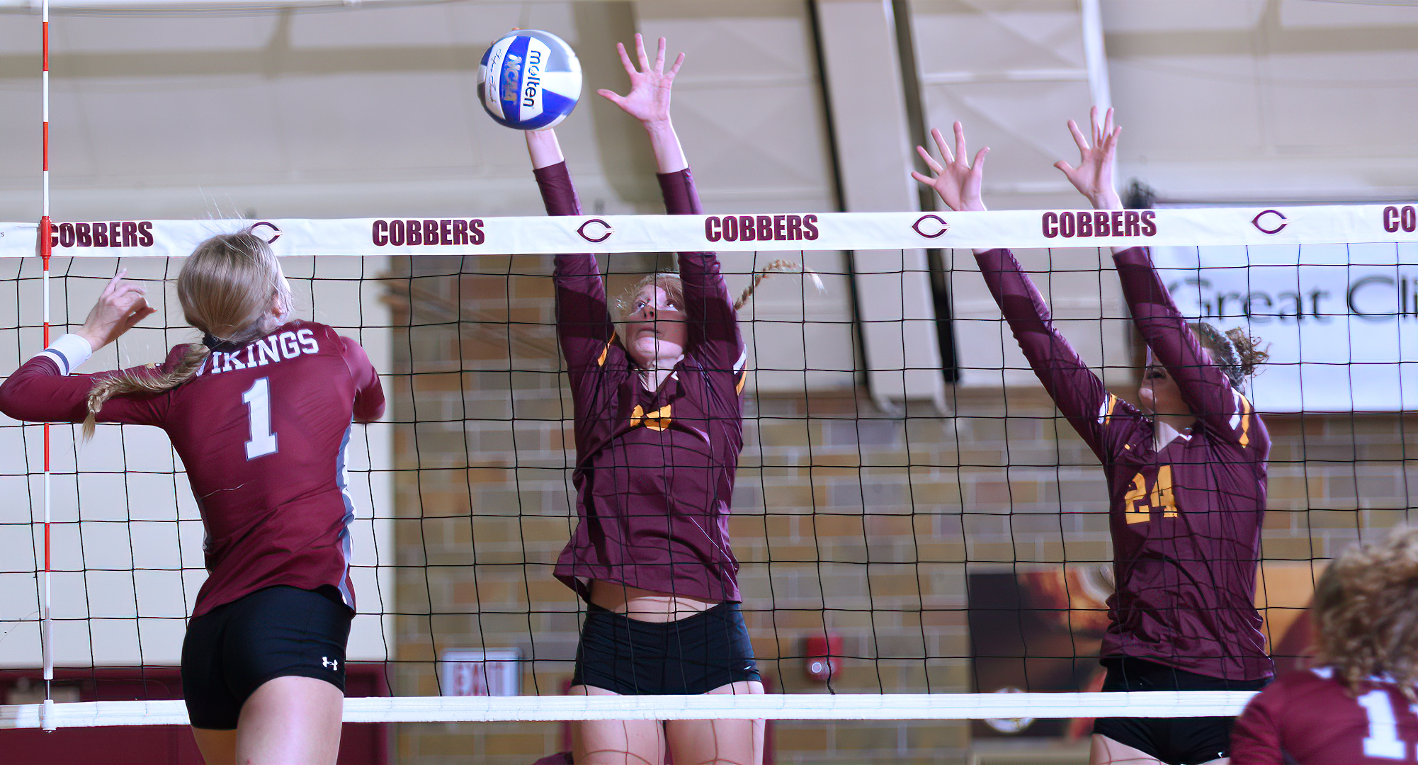 Freshman Hannah Keil (L) goes for the block in the Cobbers' match with Valley City State. She had a team-high three blocks on the night.