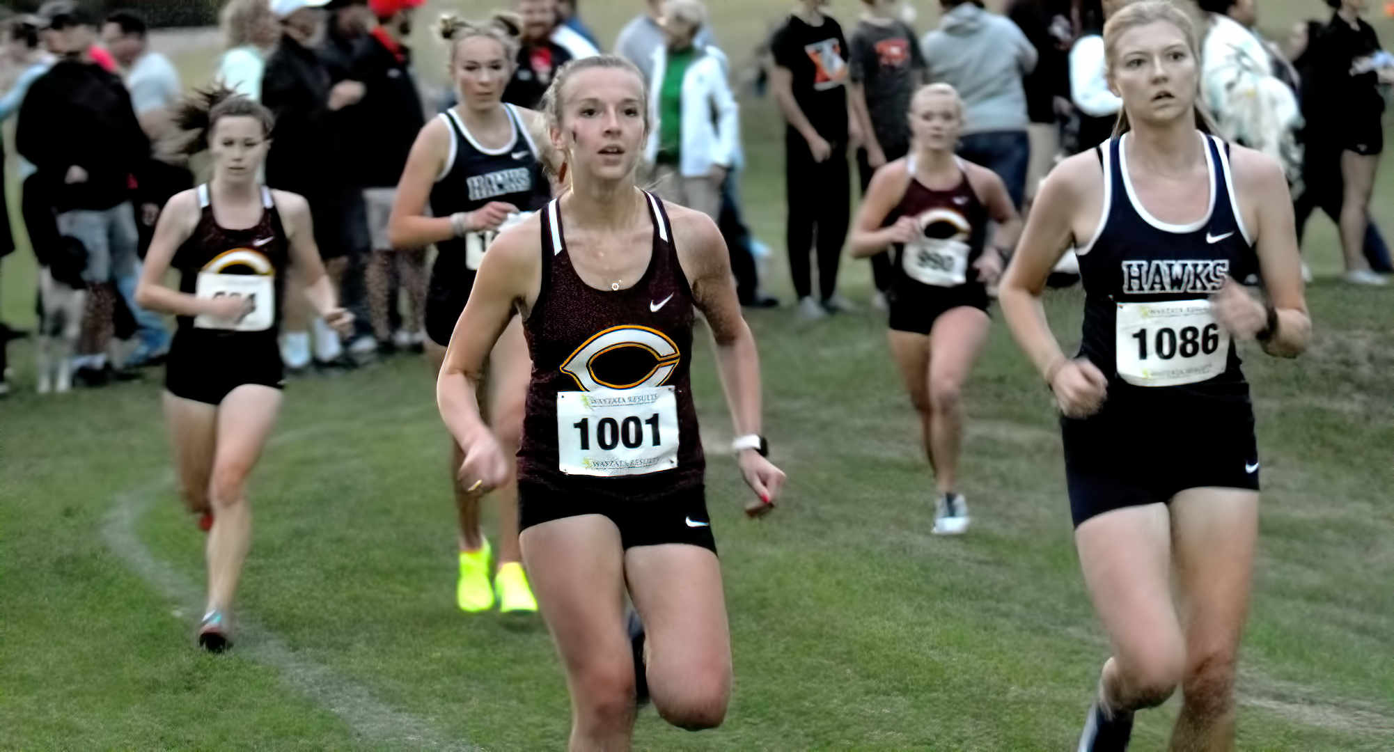 Senior Emily Rugloski races through the opening loop at the annual MSU Moorhead Twilight Meet. She led the Cobbers with a time of 15:11.8.