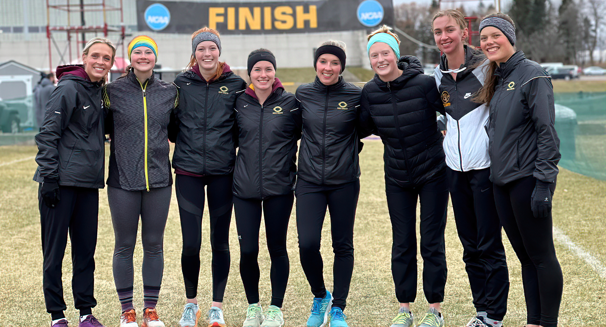 The eight members of the Cobber team that competed at the NCAA North Region Meet pose for a picture after the completion of the race.