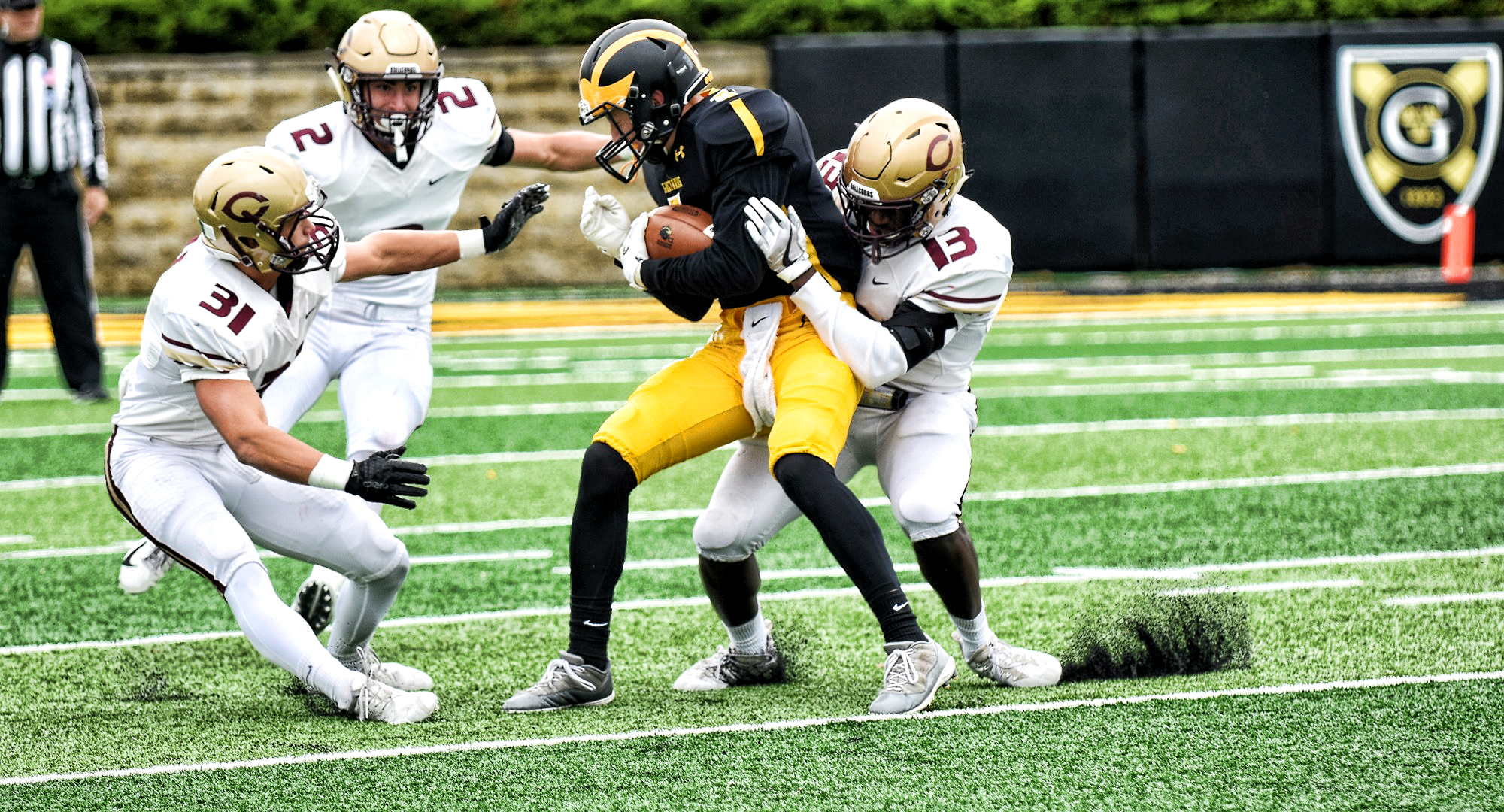 Cobber linebacker Willie Julkes (#13) puts the tackle on a Gustie ball carrier in Concordia's game at Gustavus.