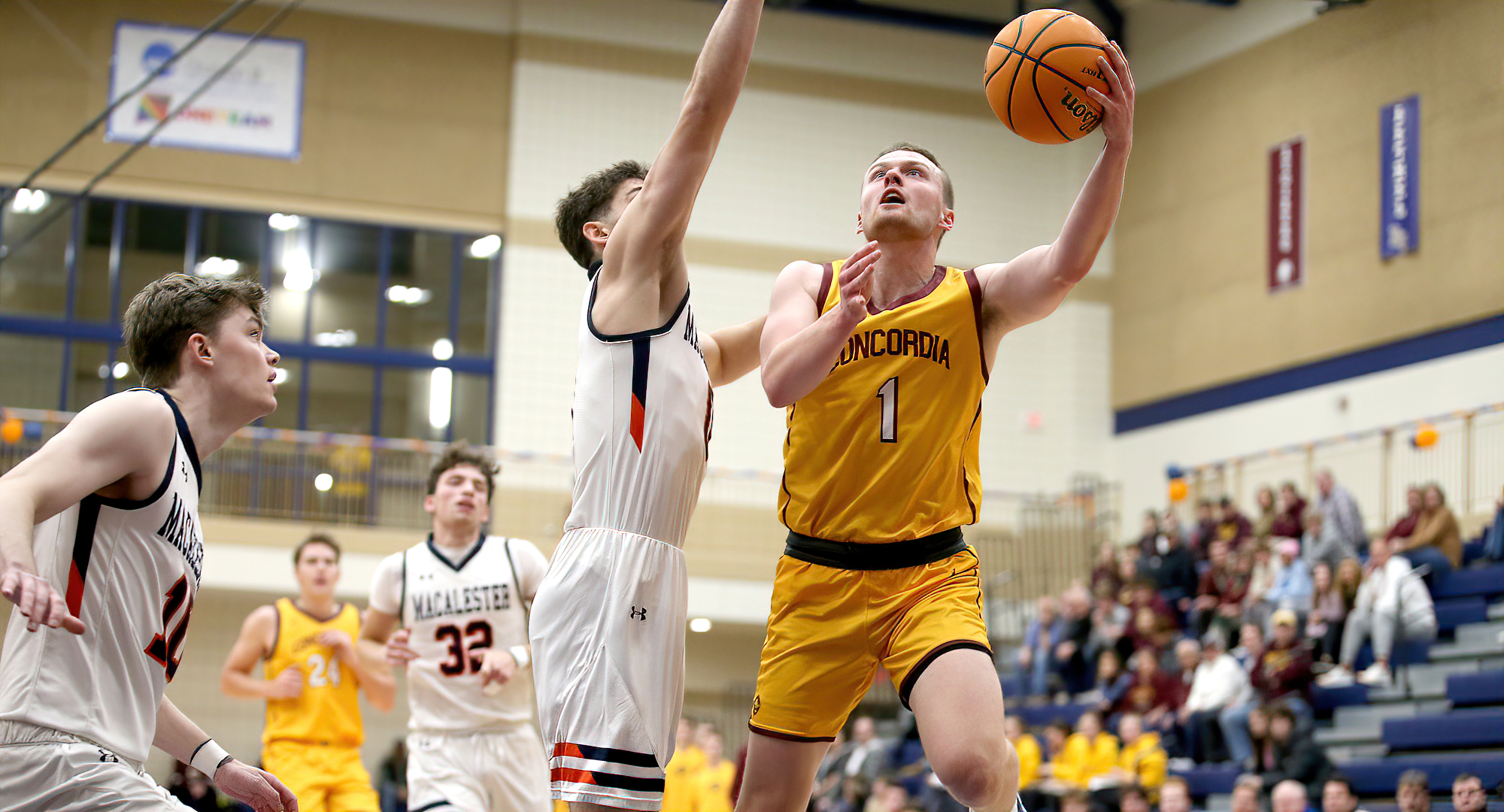 Matt Jonson takes it to the rack for two of his 19 points in the Cobbers' win at Macalester. (Photo courtesy of Ryan Coleman, d3photography)