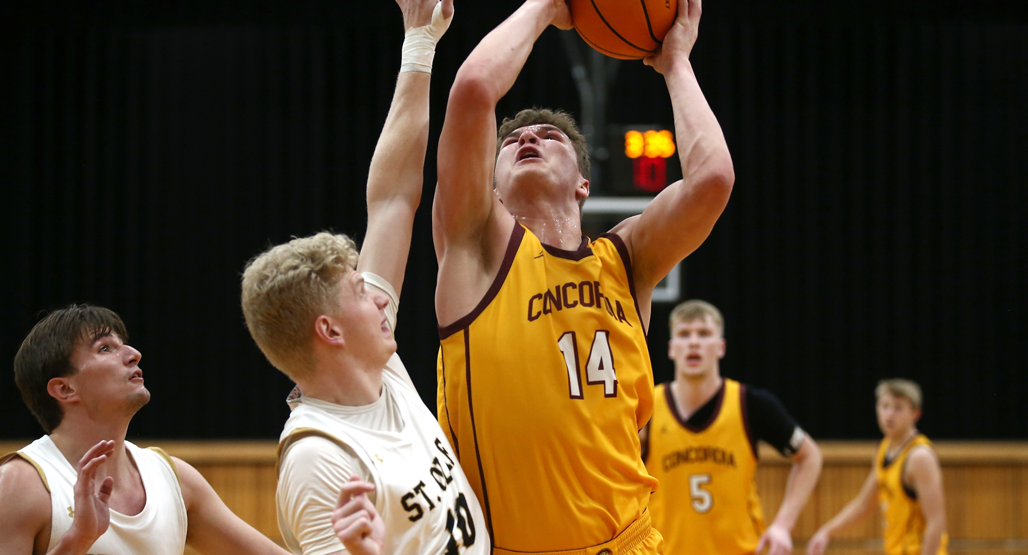 Rowan Nelson goes up for two of his team-high 13 points in the Cobbers' game at St. Olaf. (Photo courtesy of Ryan Coleman, D3photography.com)
