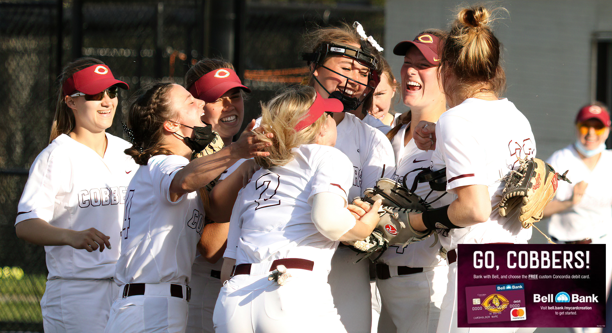 Cobber players huddle together in the middle of the infield to celebrate their first-ever postseason victory. (Photo courtesy of Isaac Dubois CSB Athletic Media Relations)