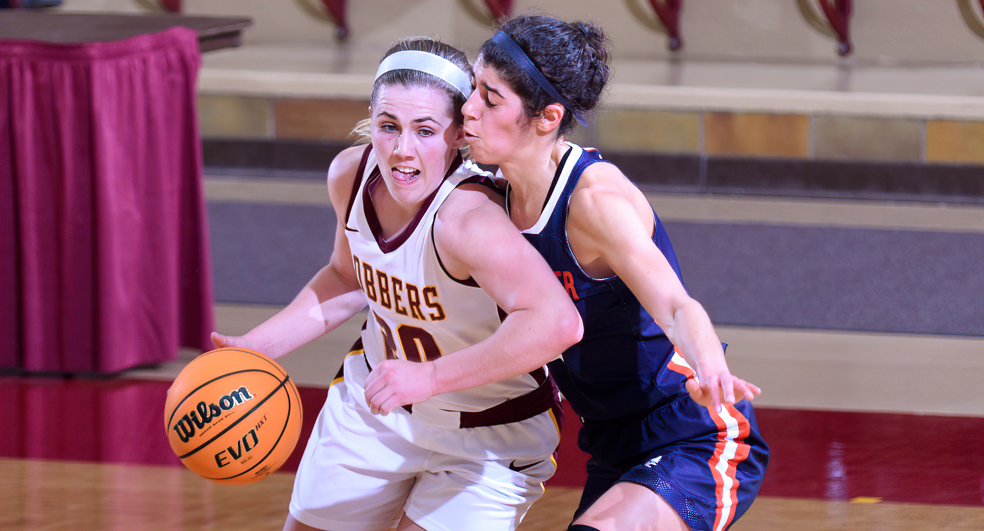 Emily Beseman drives by a Macalester defender during the second quarter in the Cobbers' game with the Scots. Beseman had a team-high 17 points.