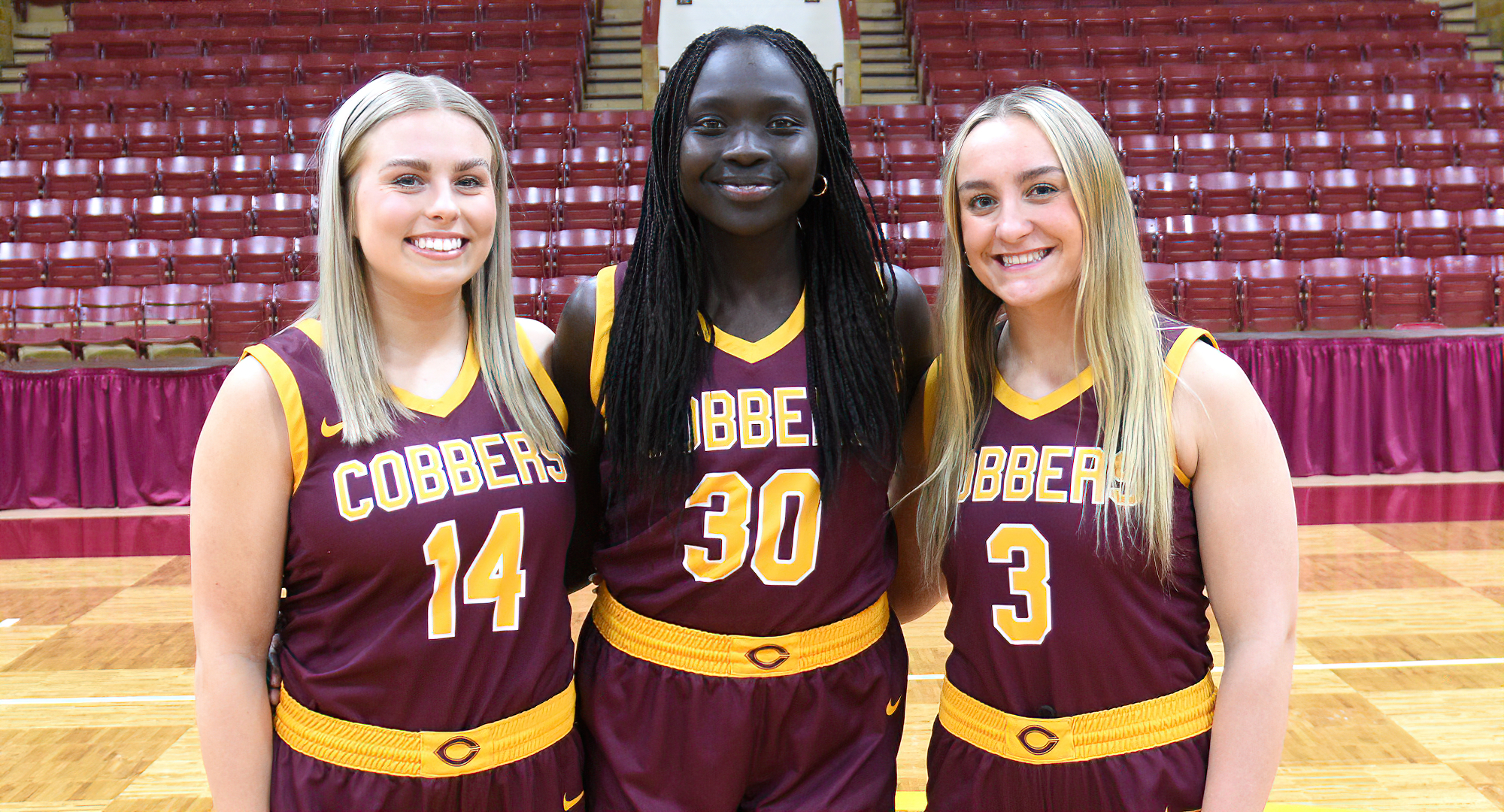 Concordia's three seniors (L-R: Kaylie Isaman, Mary Sem and Autumn Thompson) were honored at halftime of the Cobbers' 86-76 win over Hamline.