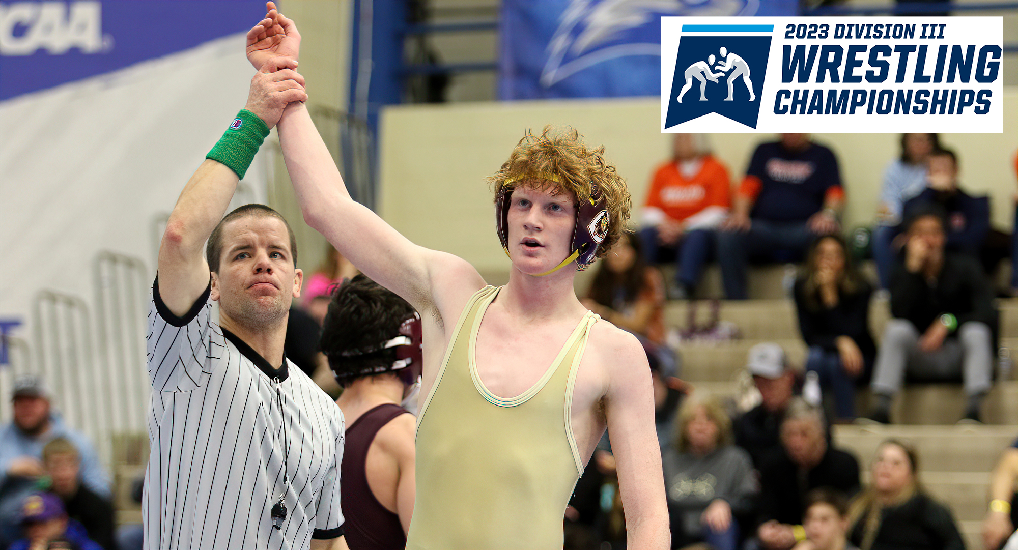 Ty Bisek has his hand raised in victory after winning the 3rd-place match at the NCAA Regional Meet which earned him a spot at nationals.